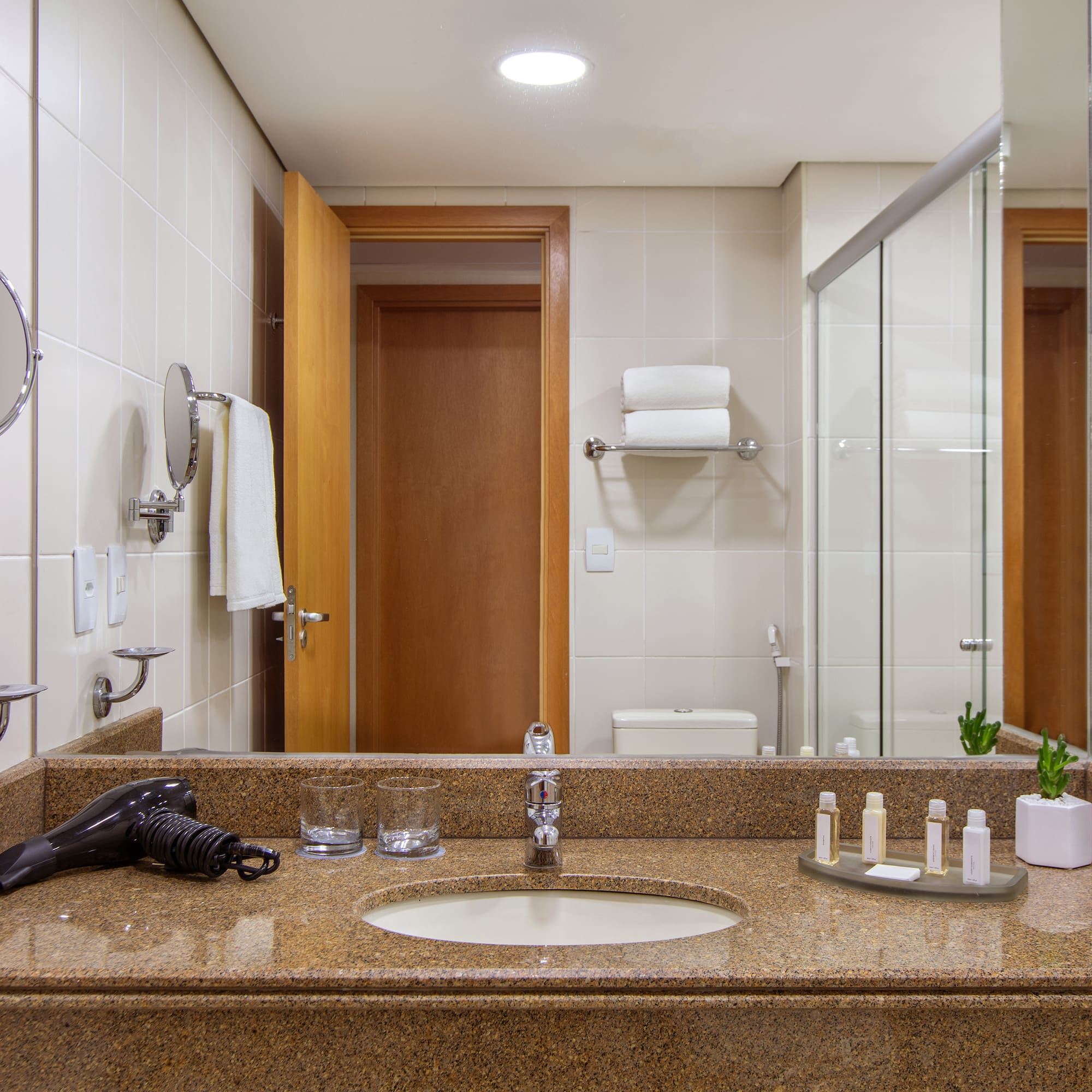 a bathroom with a mirror and a sink