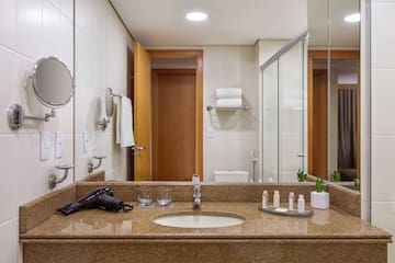 a bathroom with a mirror and a sink