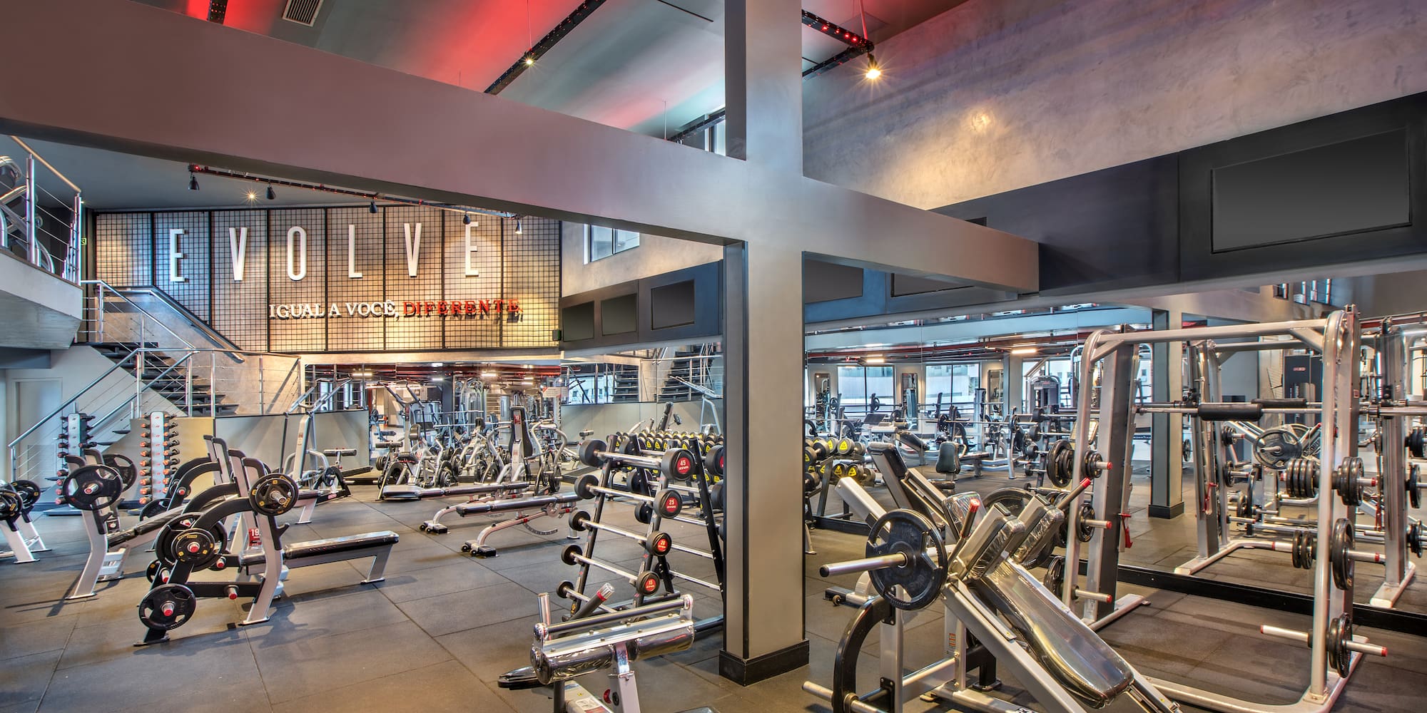 a large gym with many exercise equipment