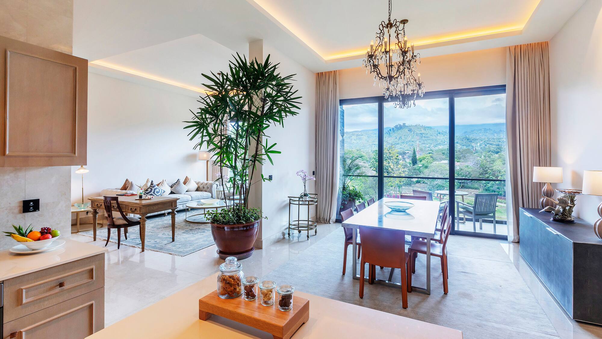 a room with a table and chairs and a large window