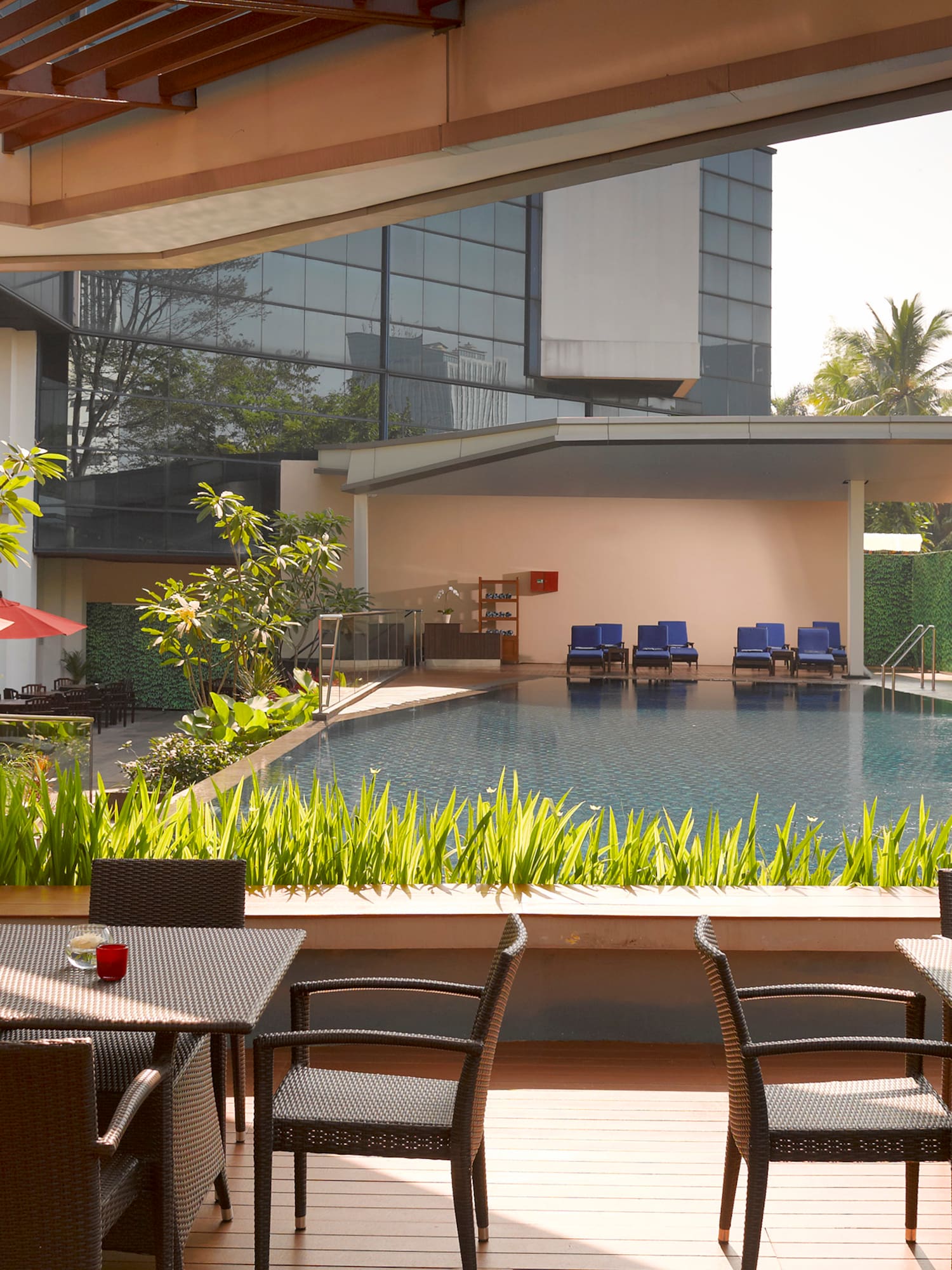 a pool with chairs and tables