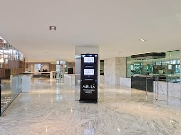 a large marble floor with a sign in it