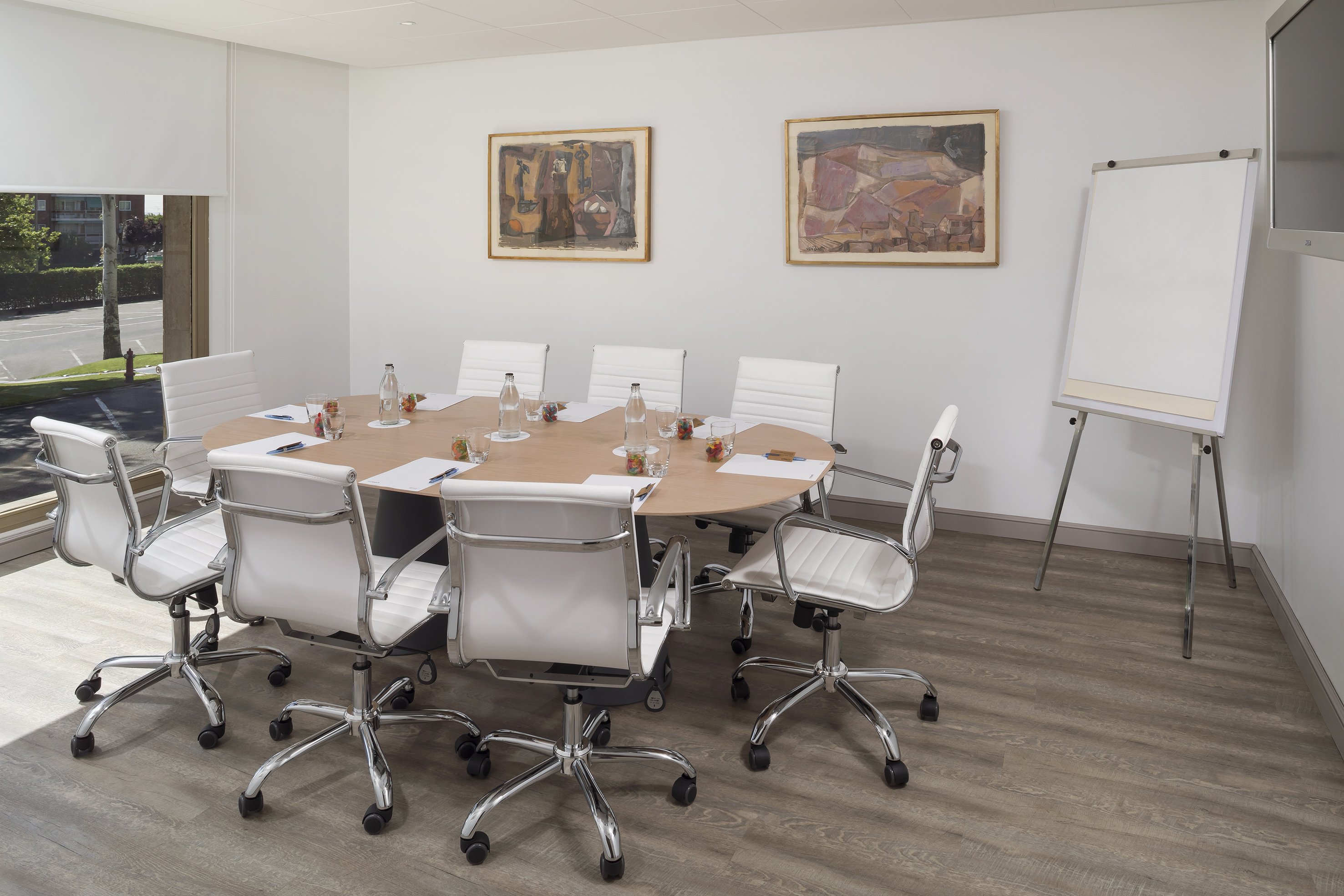 a conference room with a table and chairs