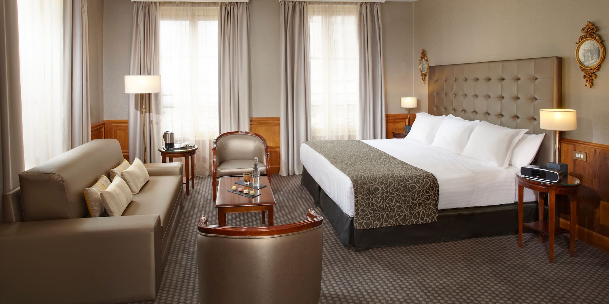 a hotel room with a bed and a couch