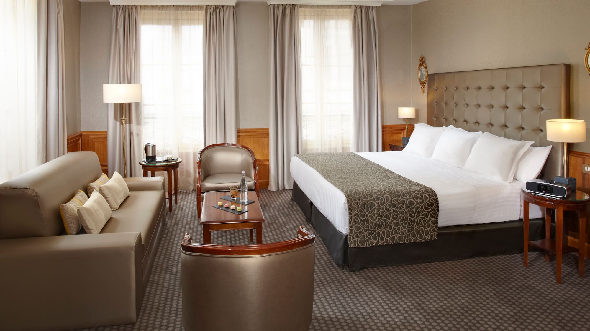 a hotel room with a bed and a couch