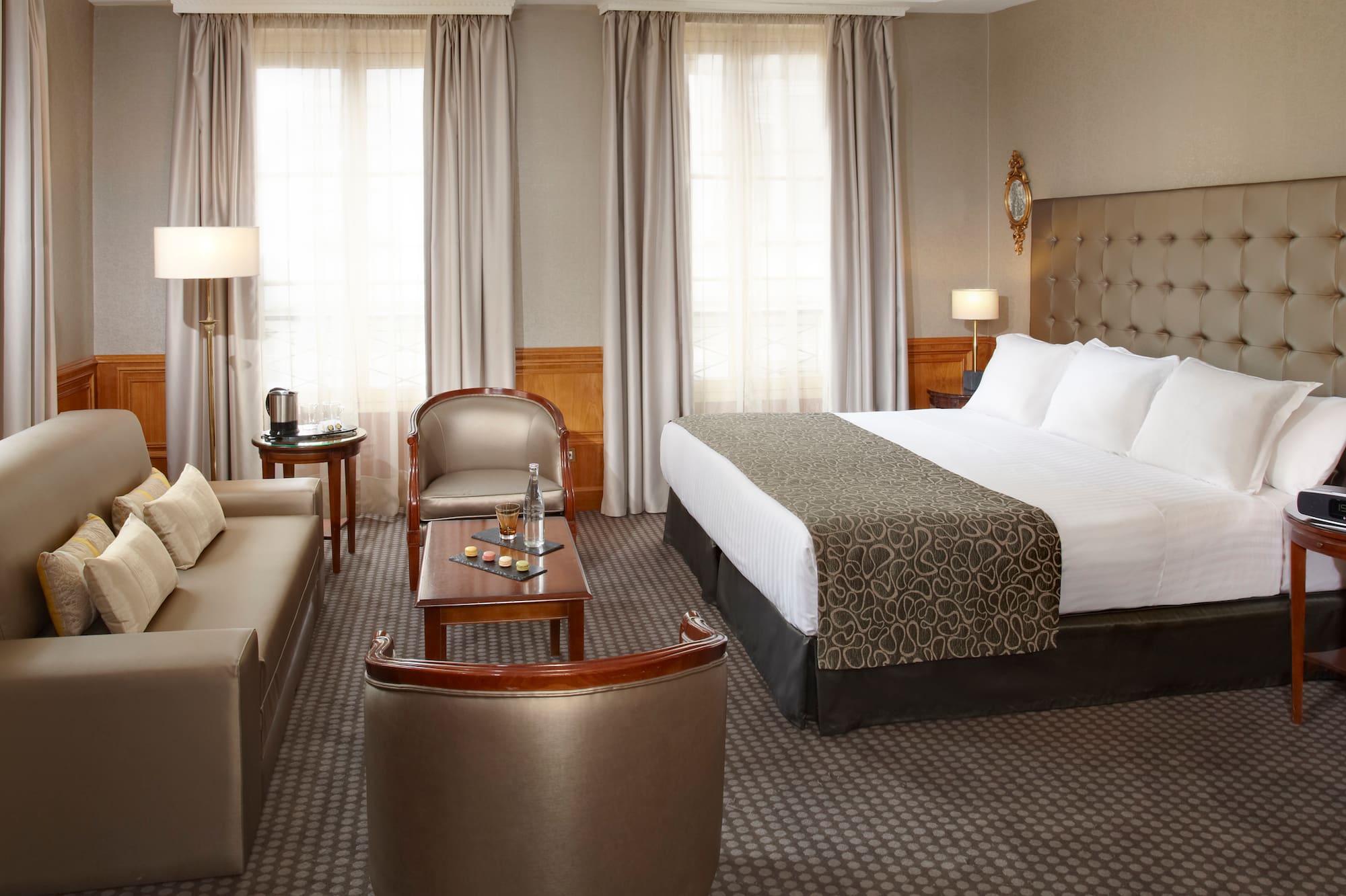 a hotel room with a bed and a couch