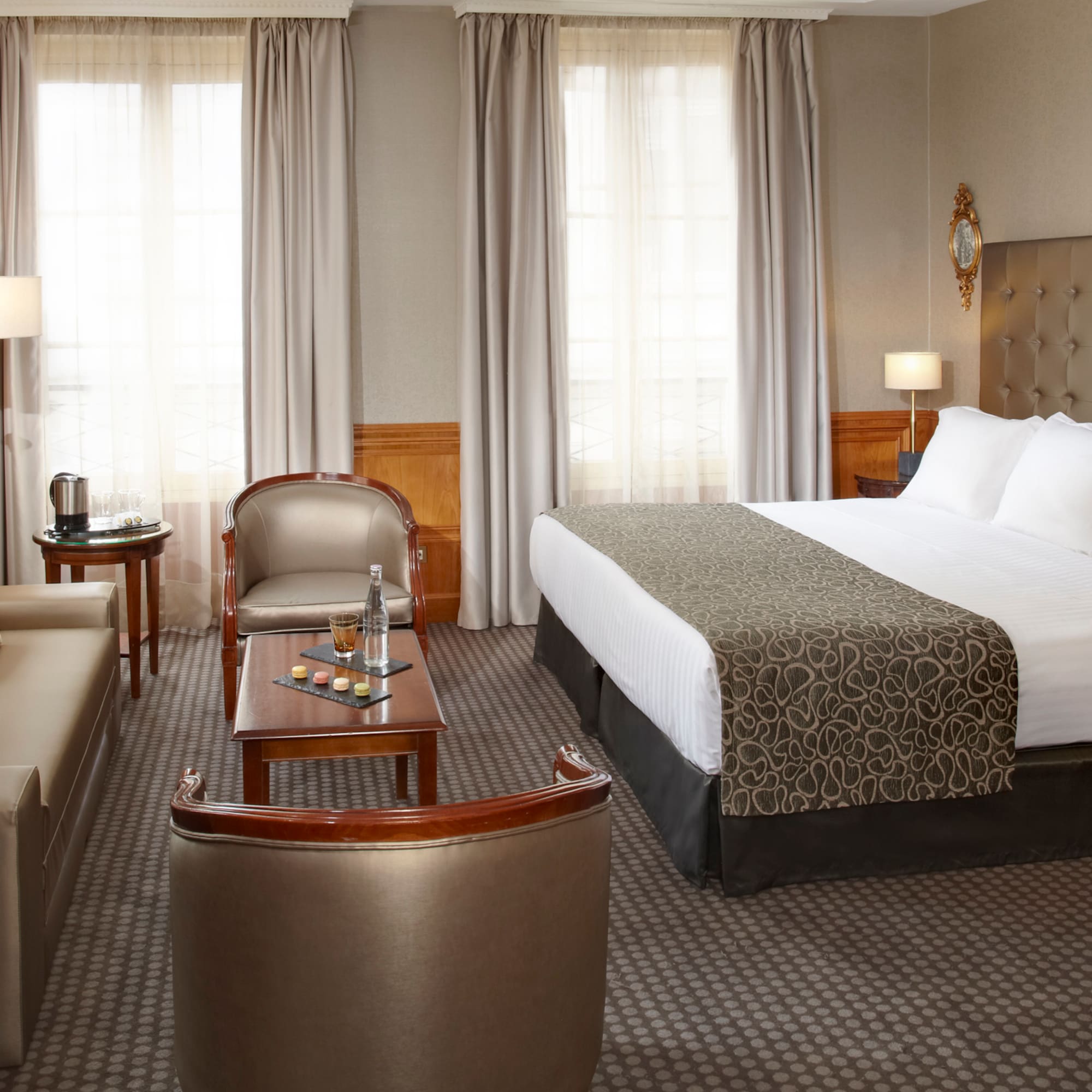 a hotel room with a bed and a couch