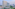 Melia Yangon hotel, modern high-rise with blue windows, green terraced roof.