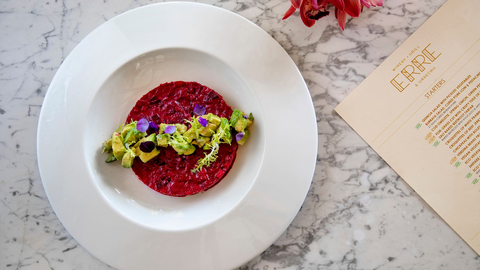 a plate of food on a marble table