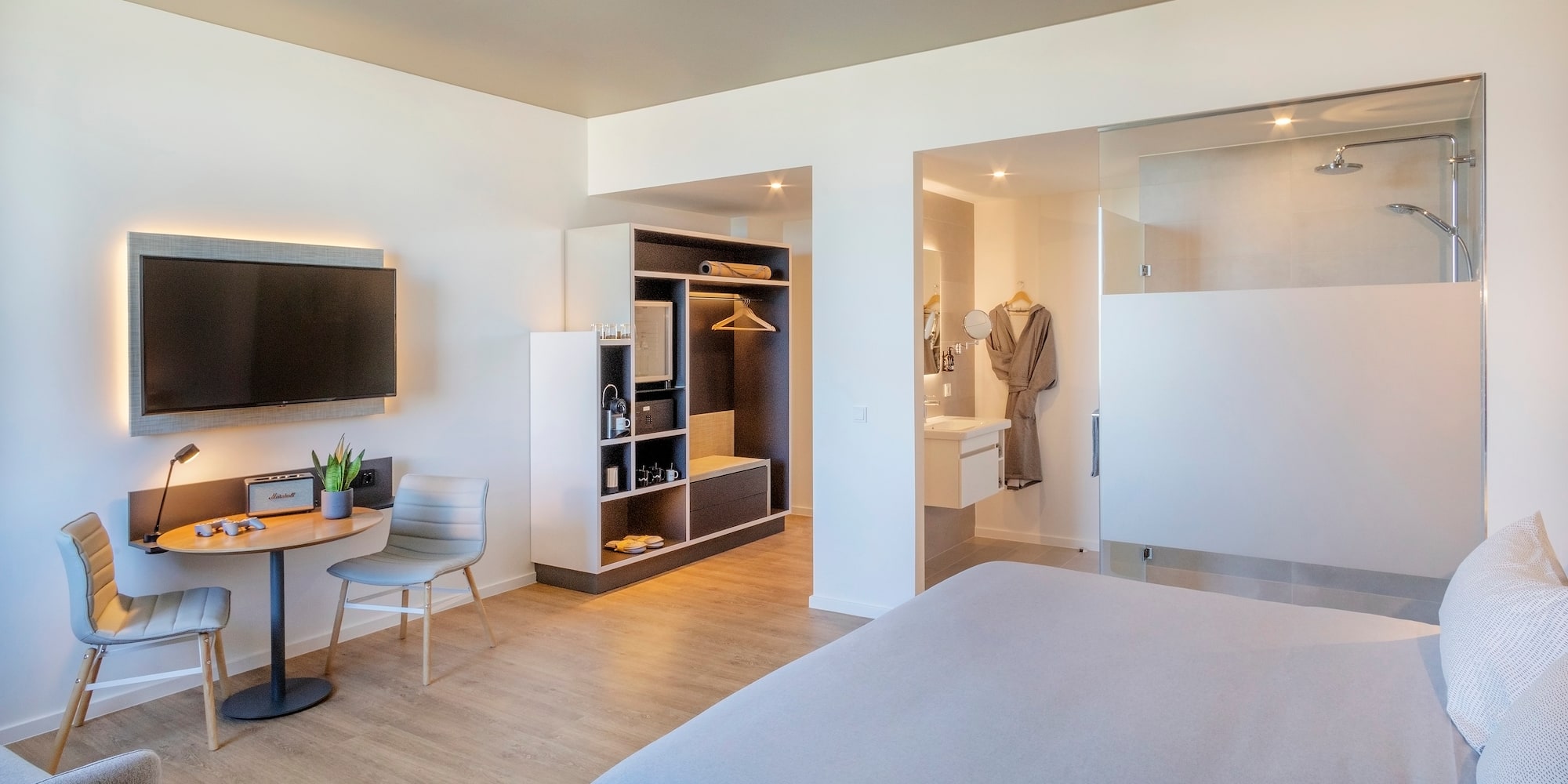 a room with a bed and a tv