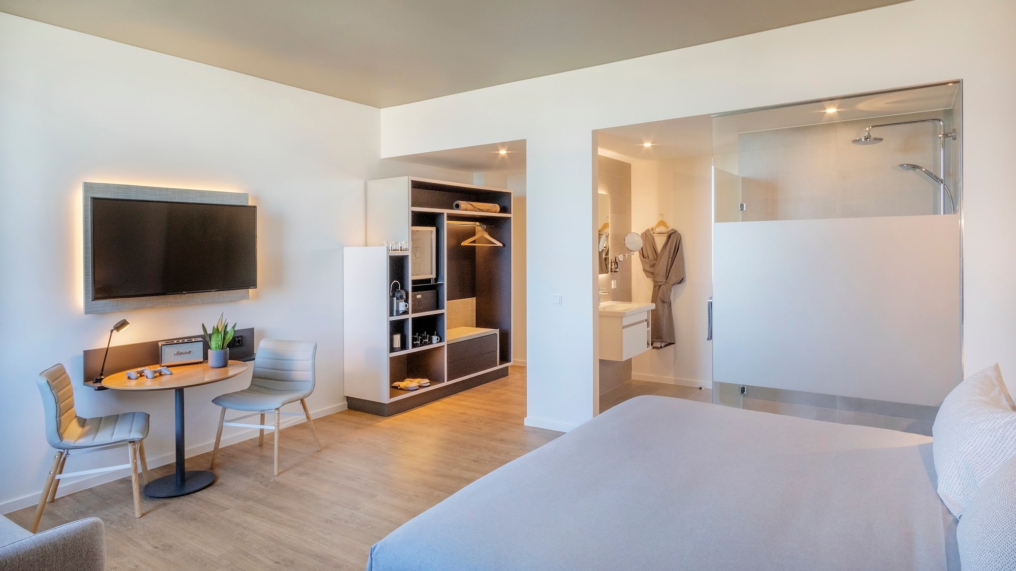 a room with a bed and a tv