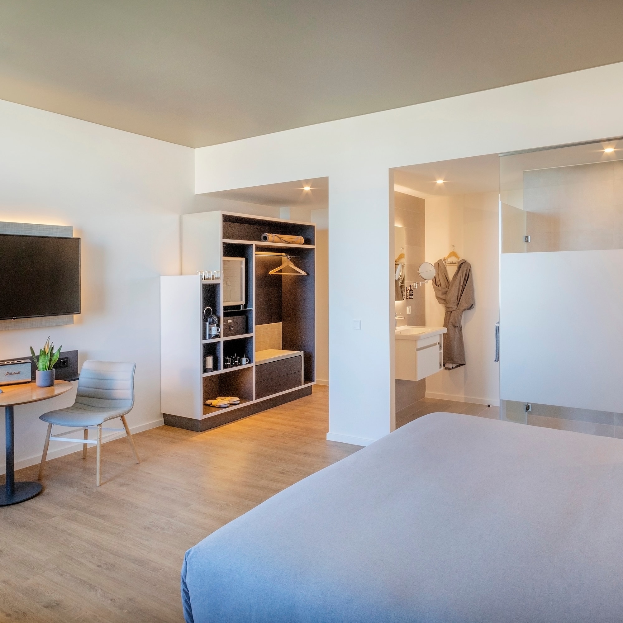 a room with a bed and a tv