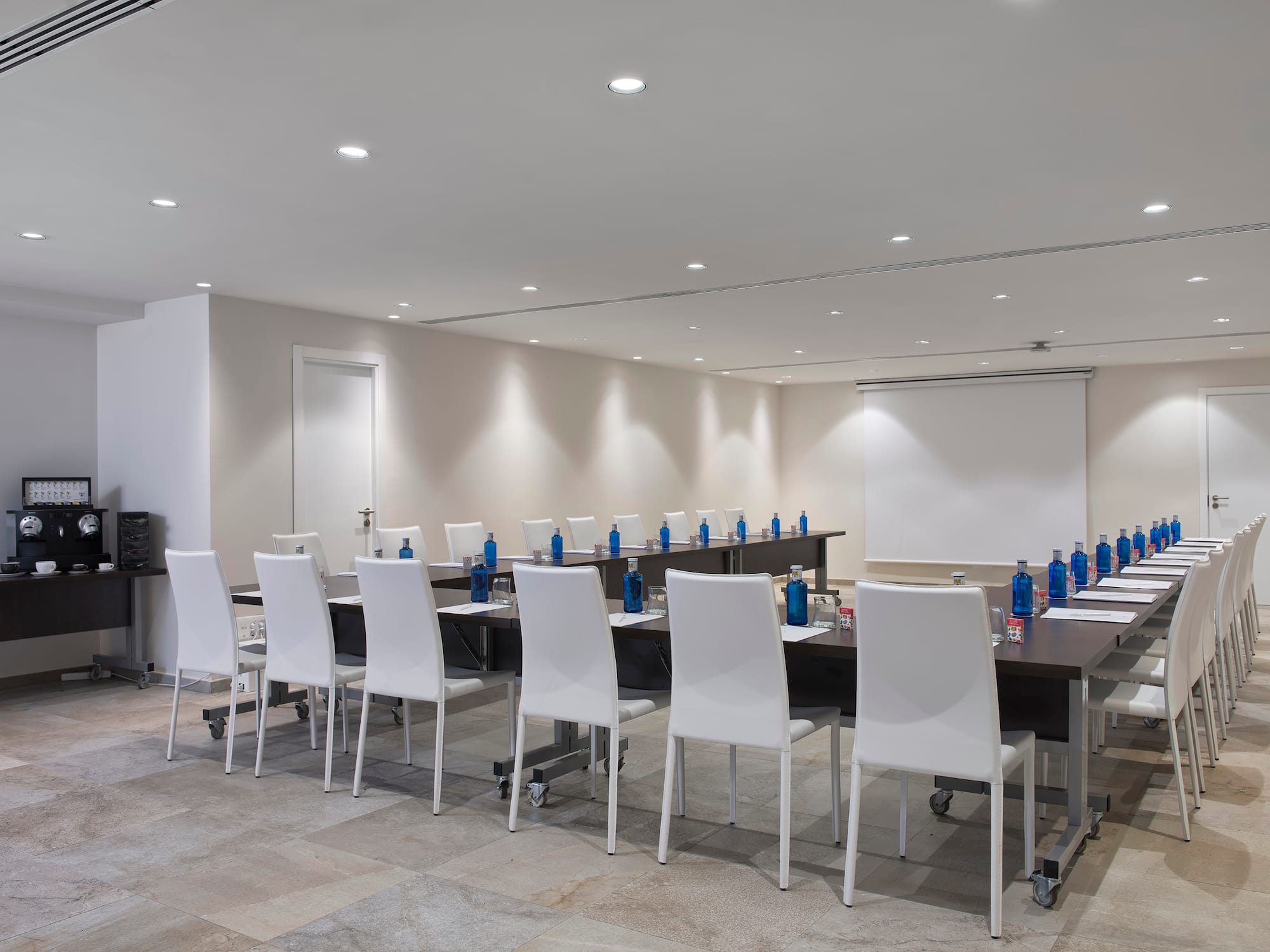 a conference room with a table and chairs