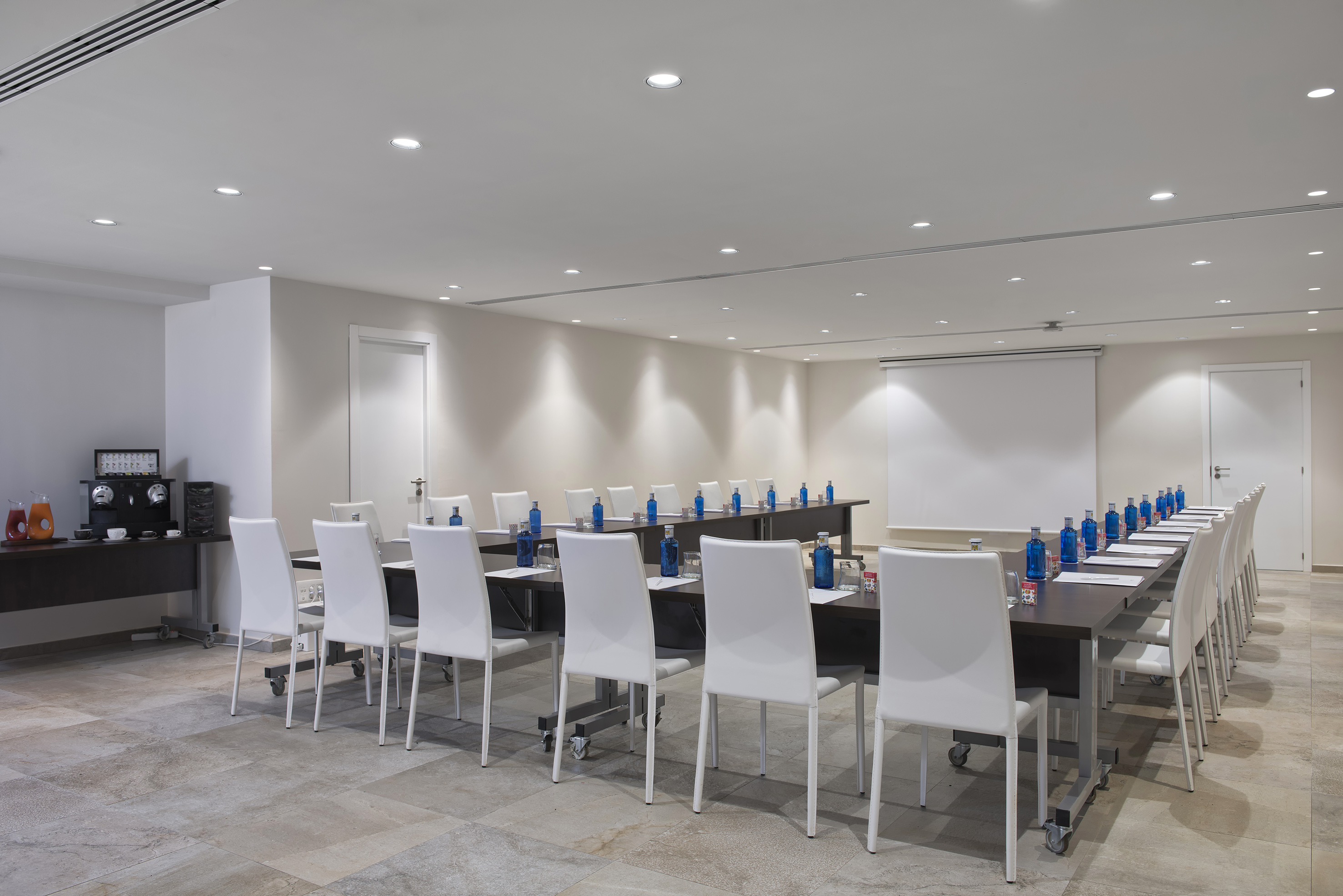 a conference room with a table and chairs