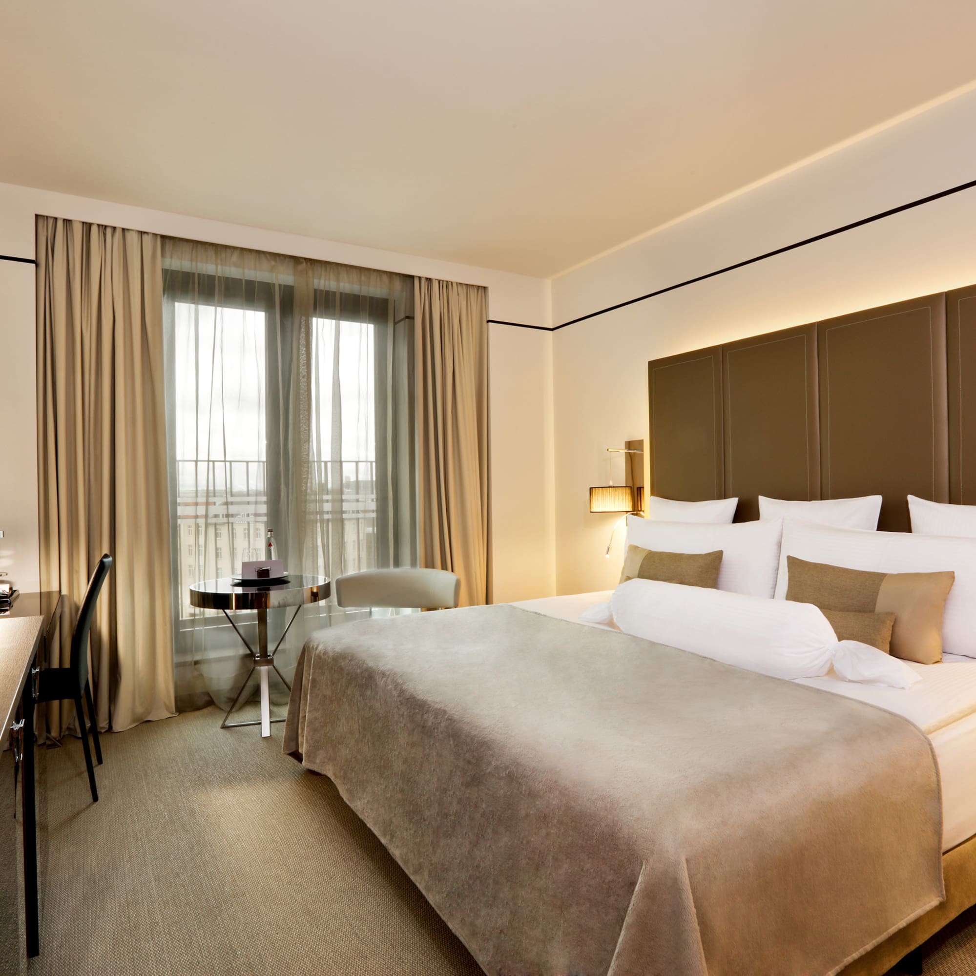 a room with a bed and a desk