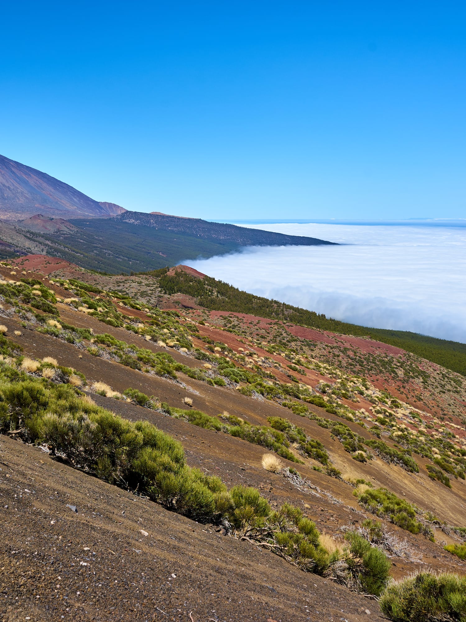 a mountain with a mountain in the background