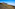 a mountain with a mountain in the background
