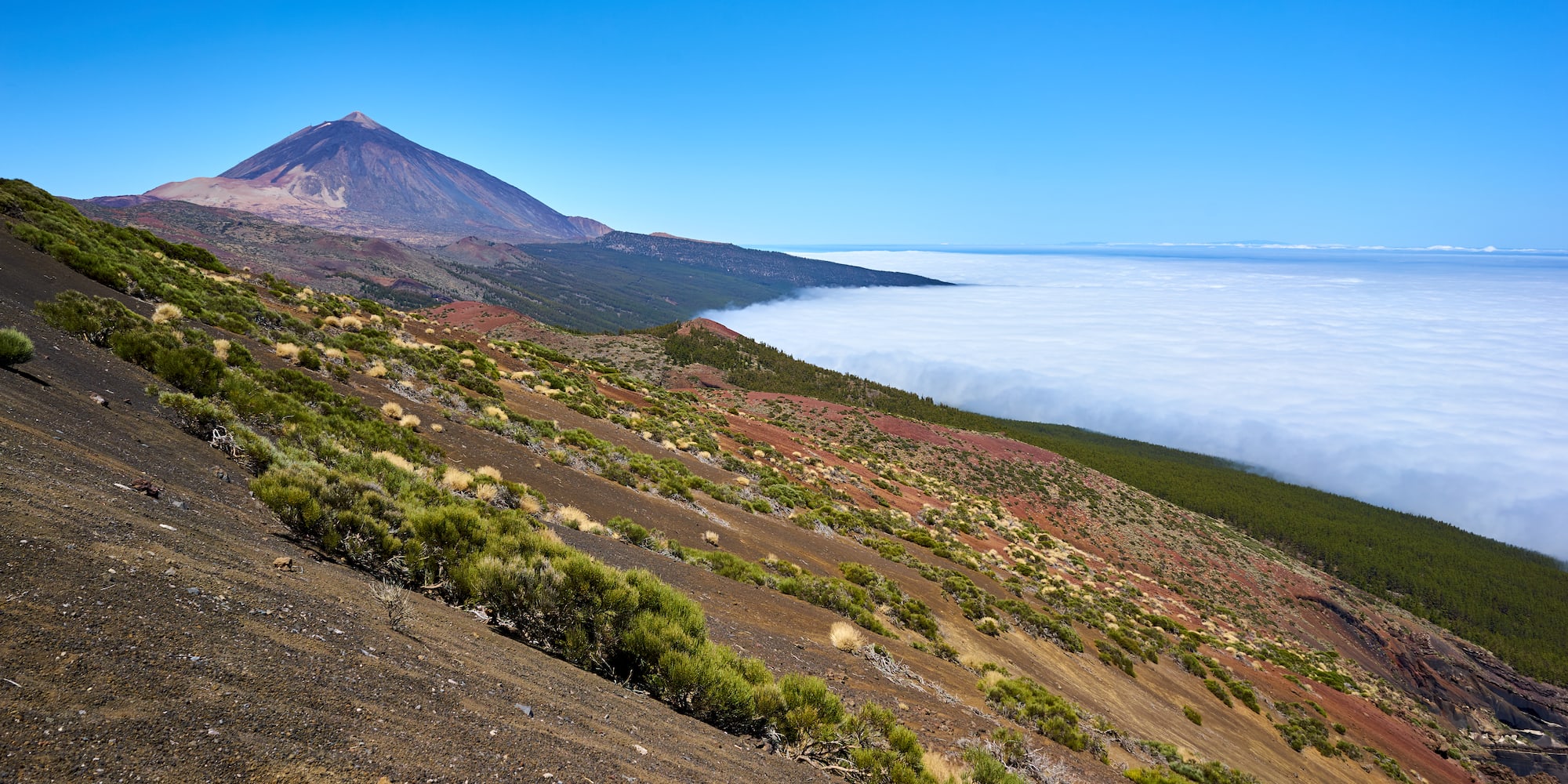 a mountain with a mountain in the background