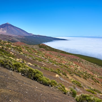 a mountain with a mountain in the background