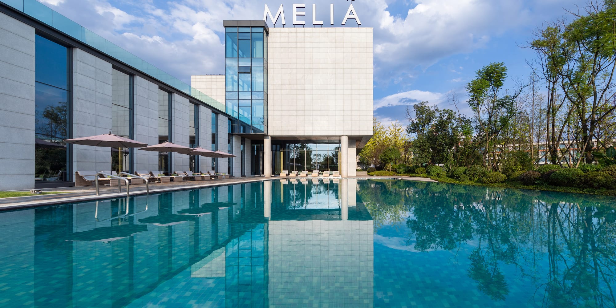 a pool in front of a building