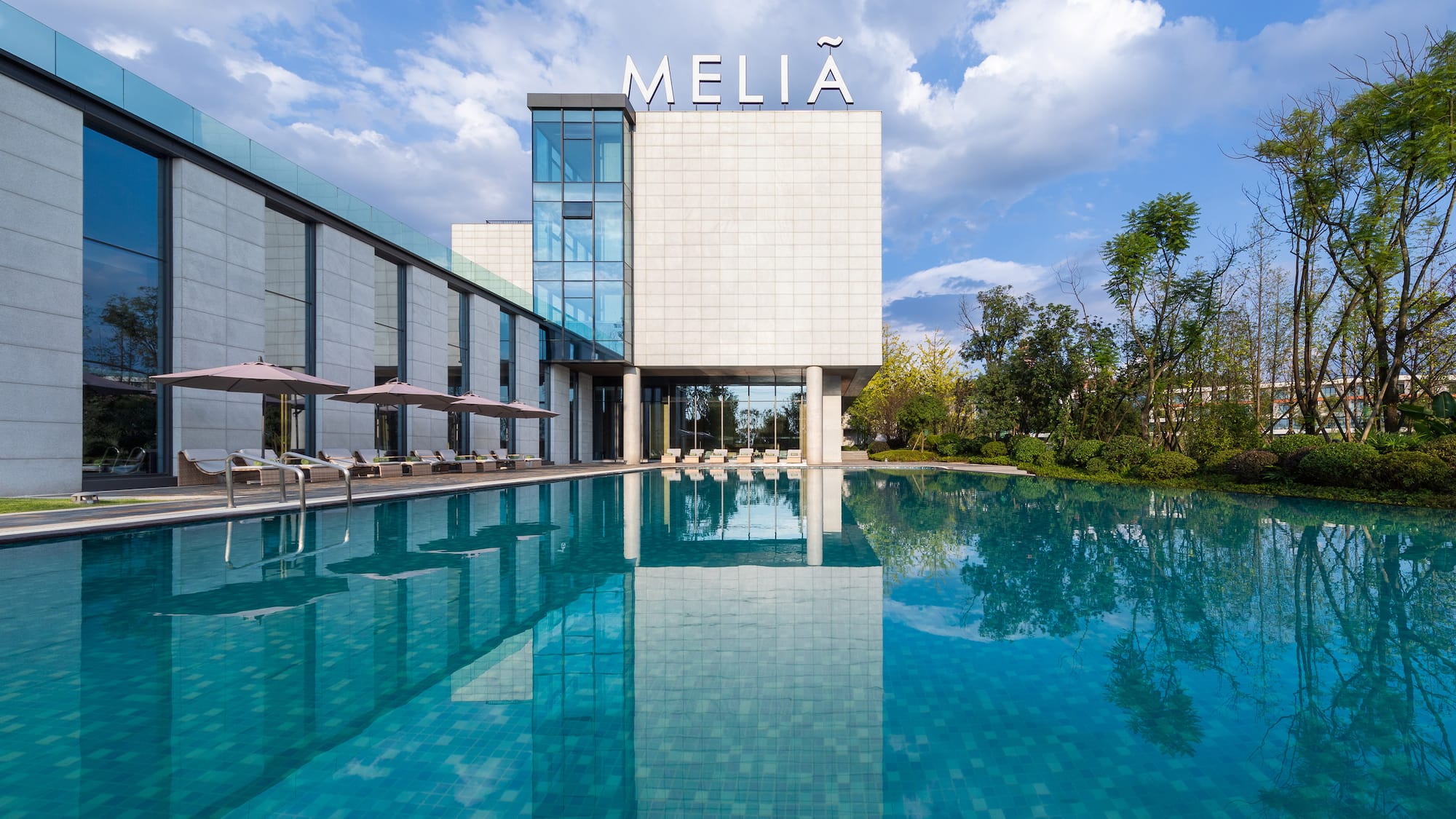 a pool in front of a building