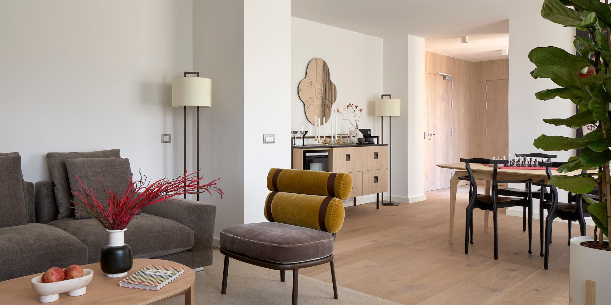 a living room with a table and chairs