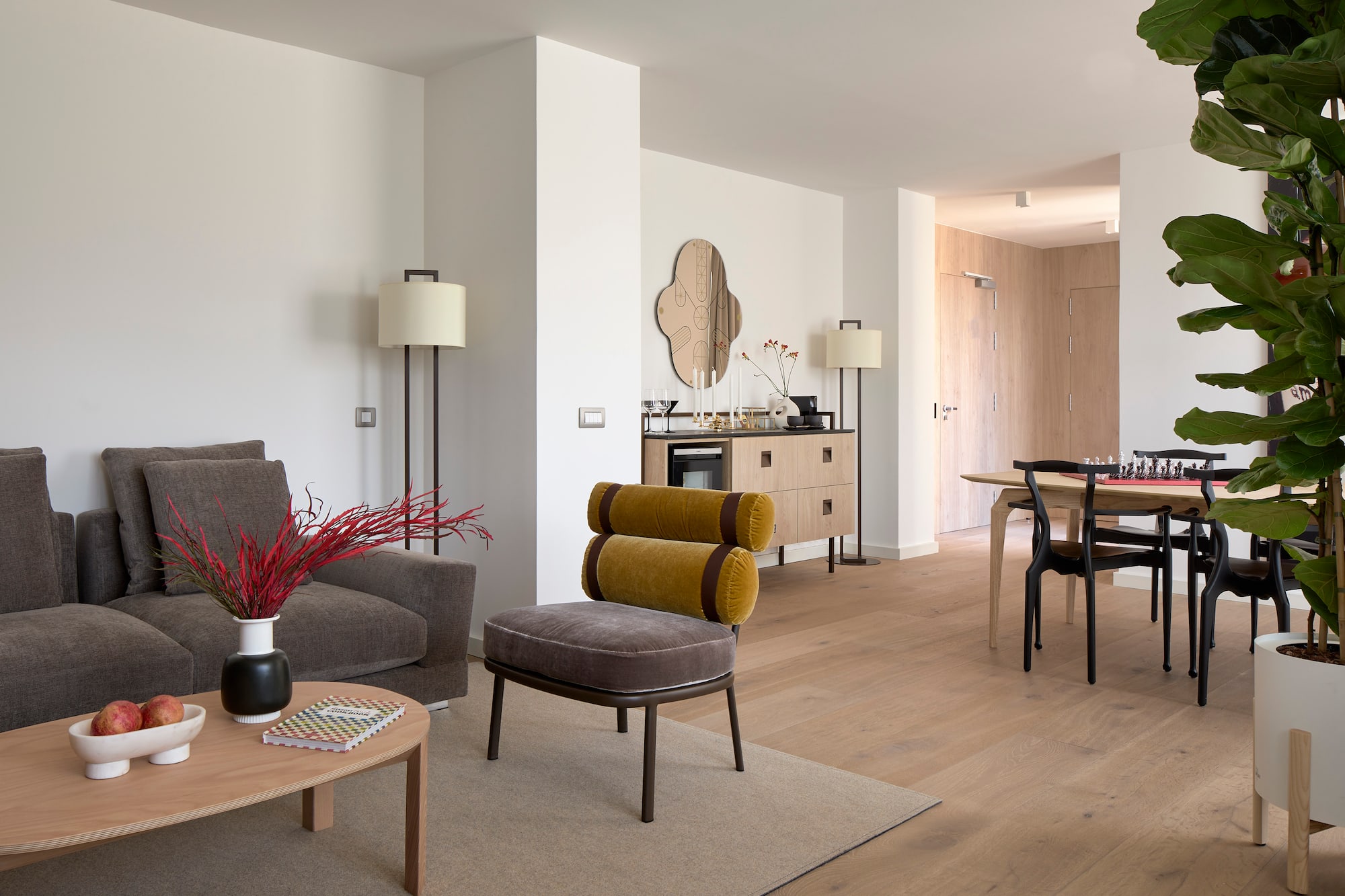 a living room with a table and chairs