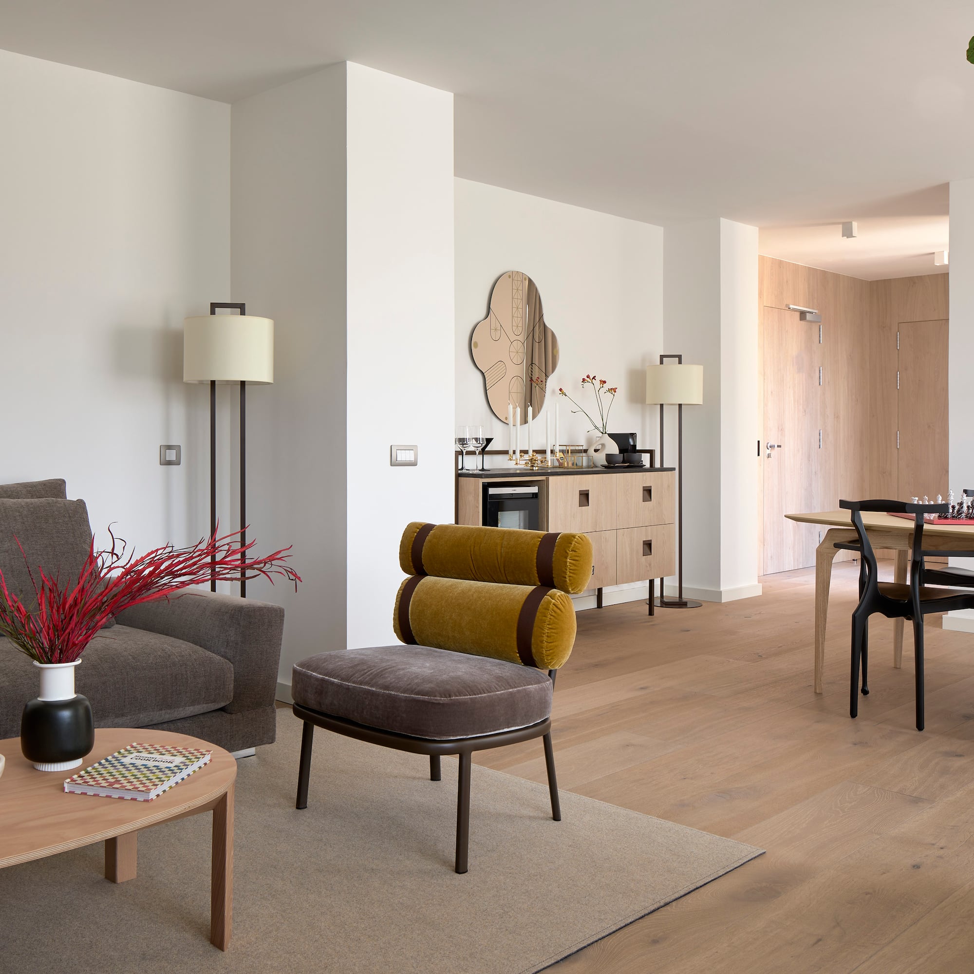 a living room with a table and chairs