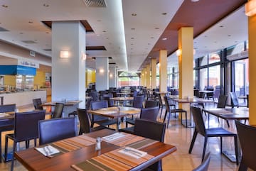 a restaurant with tables and chairs