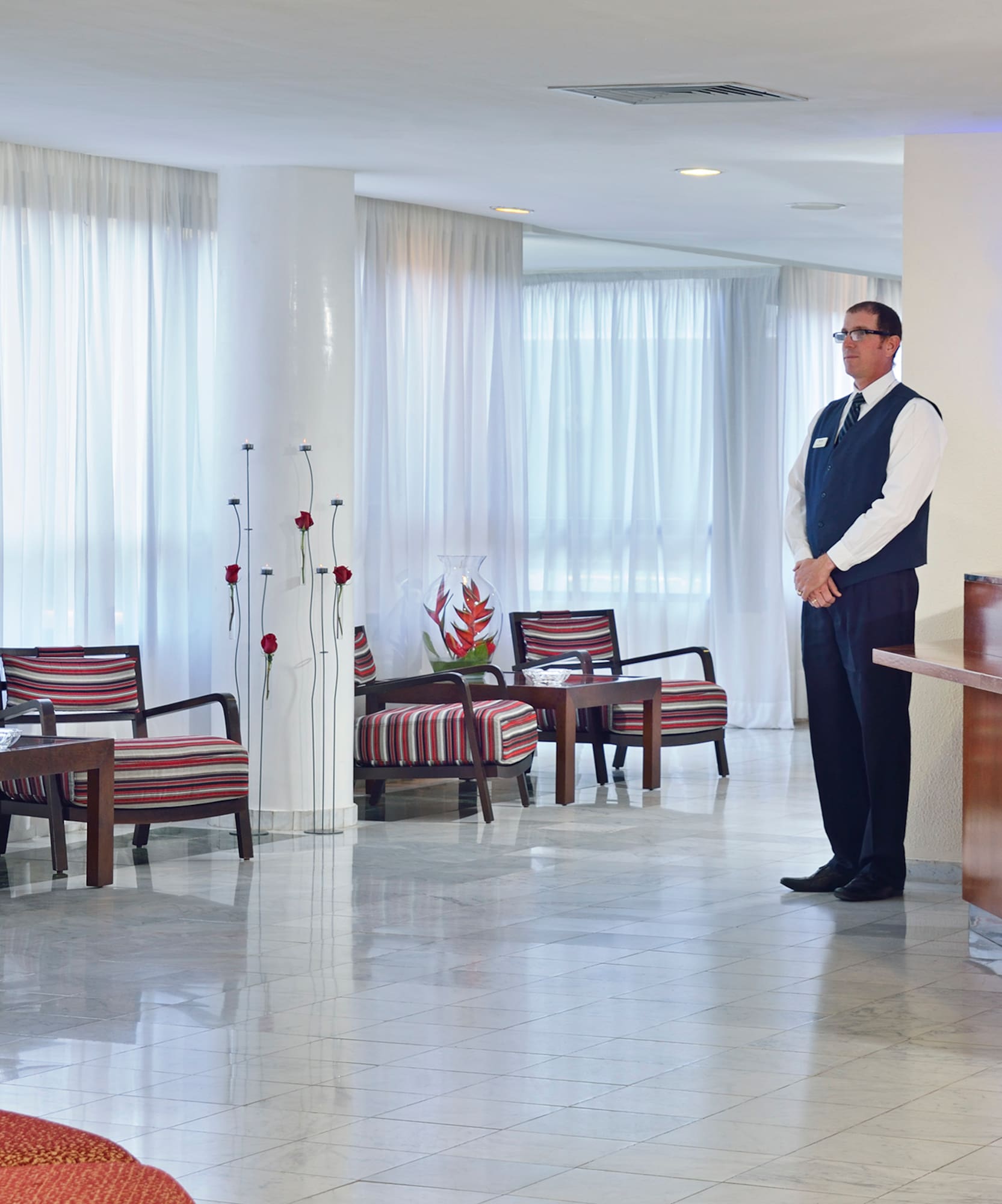 a man standing in a hotel lobby