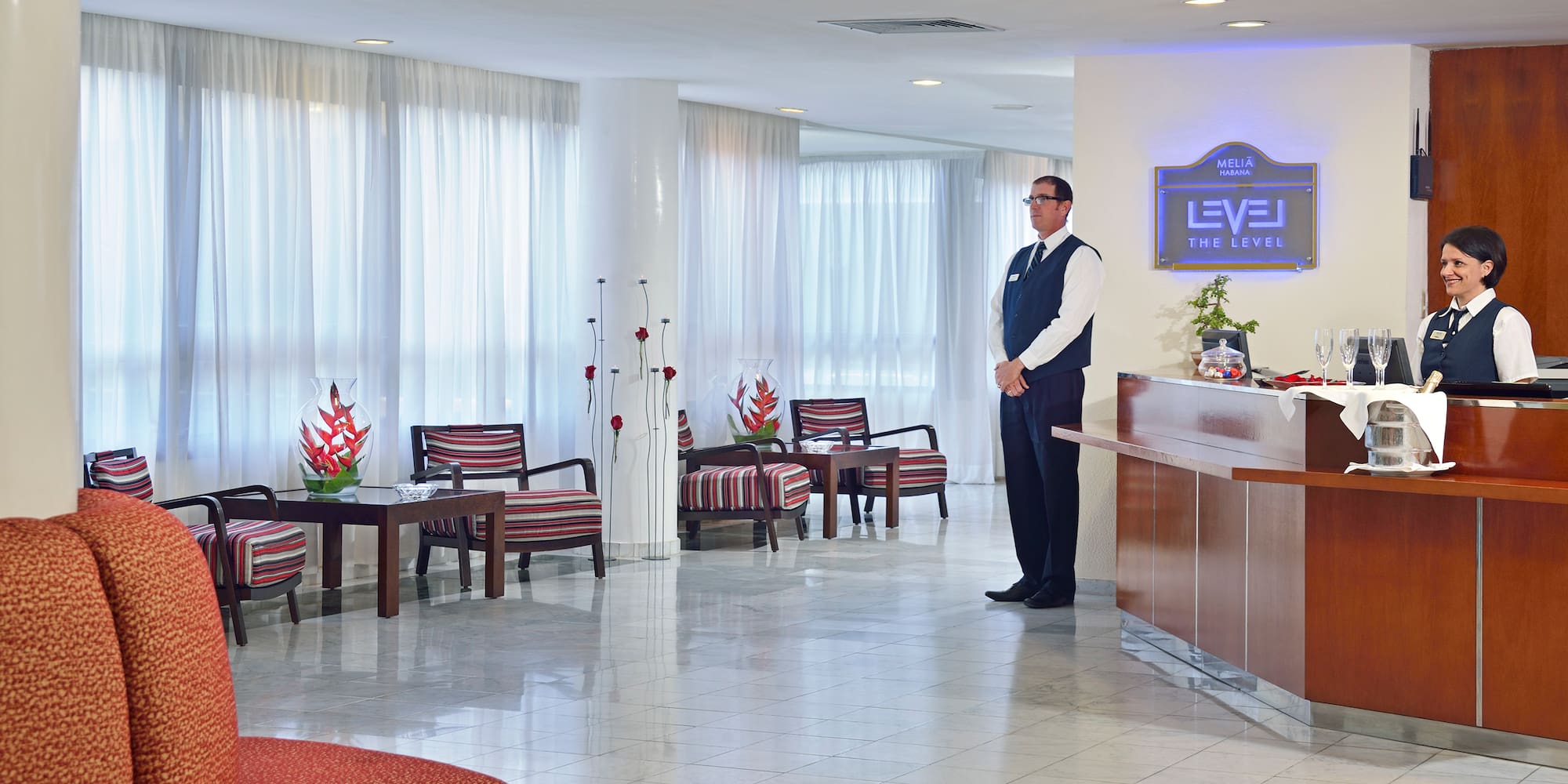 a man standing in a hotel lobby