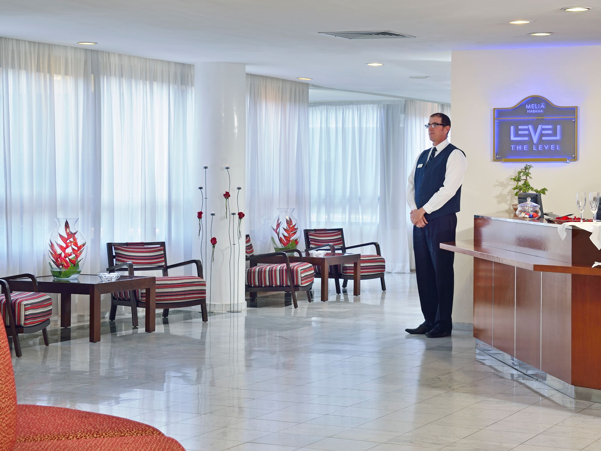 a man standing in a hotel lobby