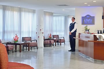 a man standing in a hotel lobby