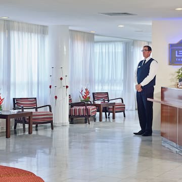a man standing in a hotel lobby
