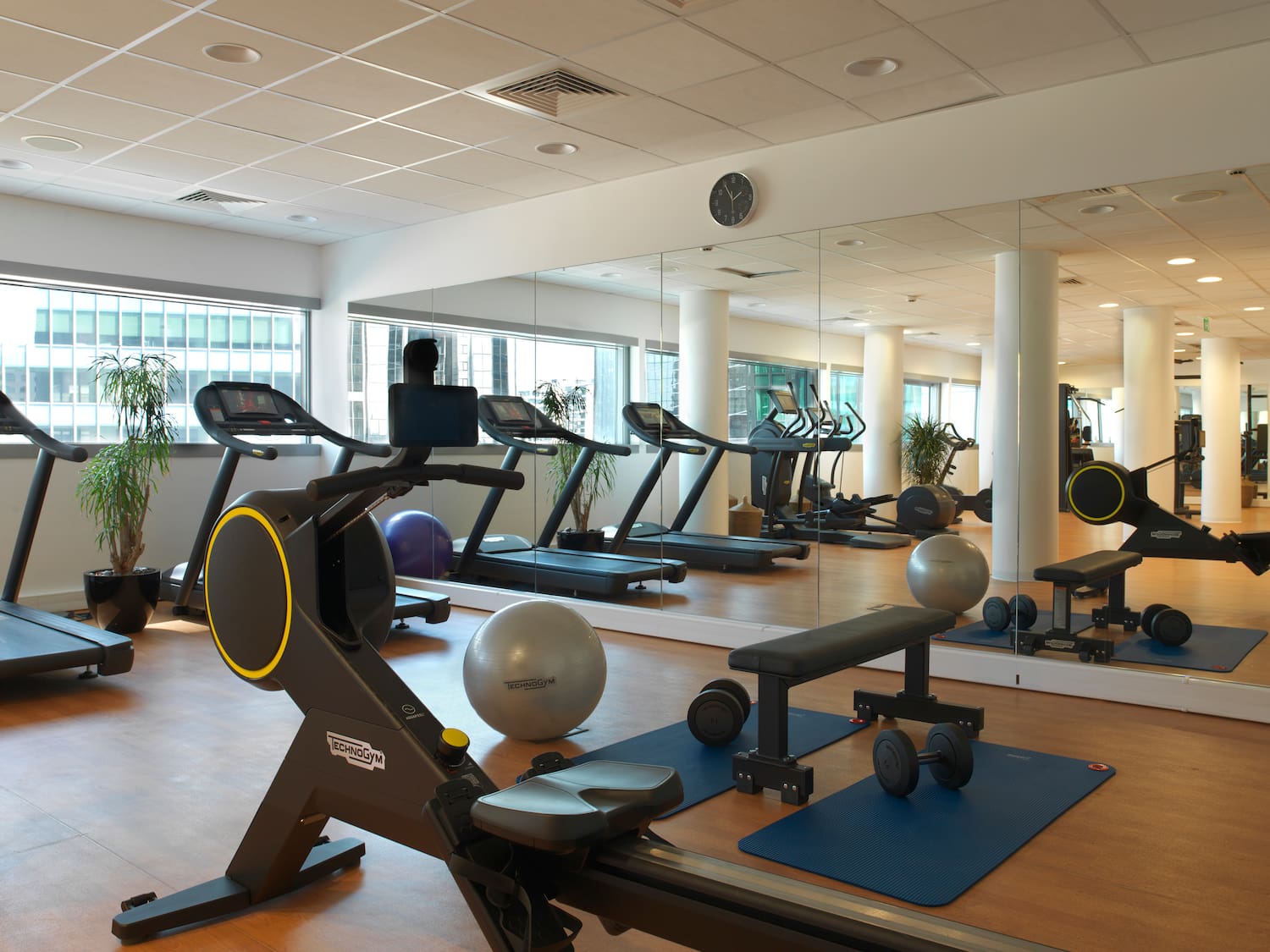 a large room with exercise equipment