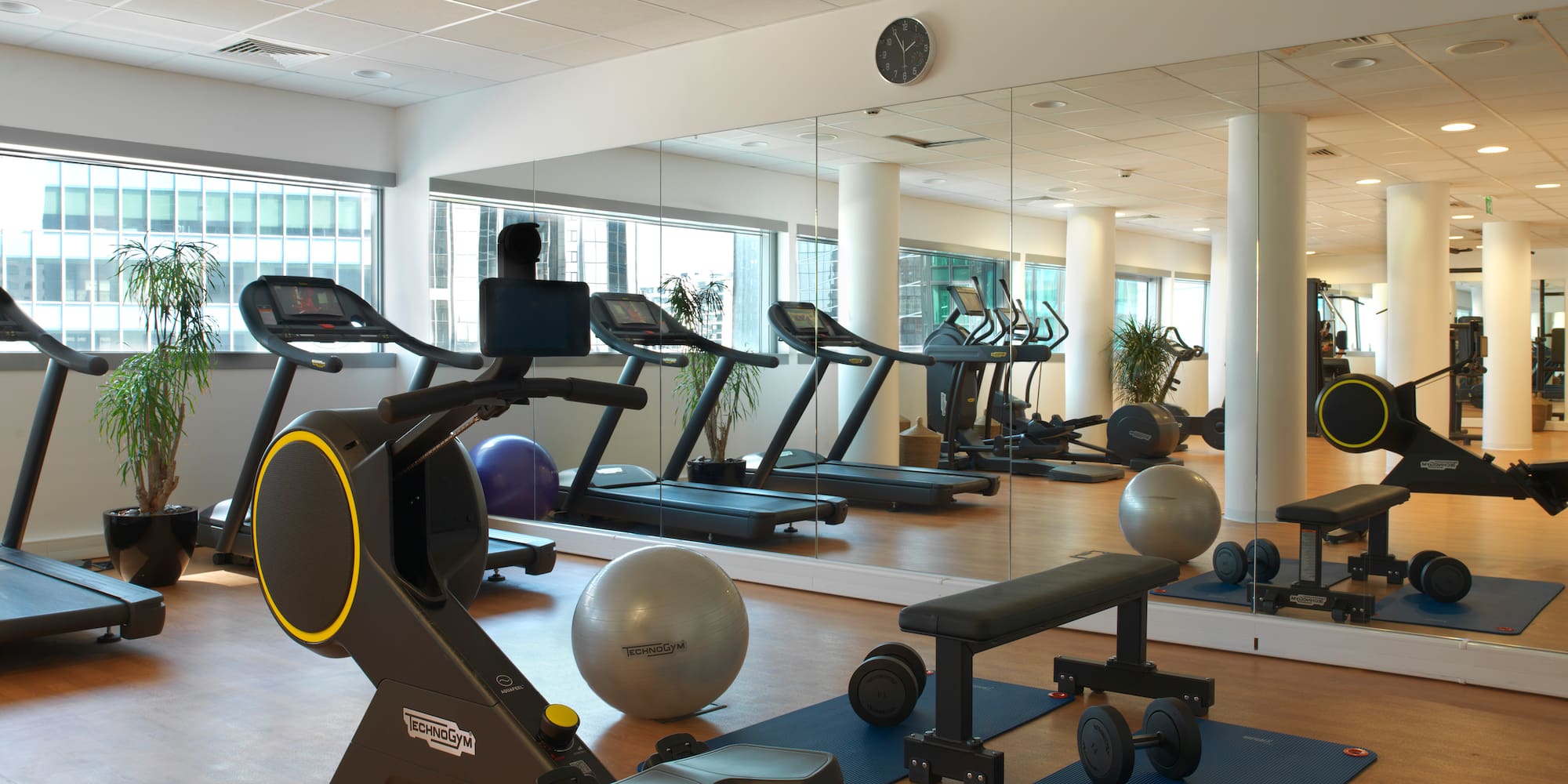 a large room with exercise equipment