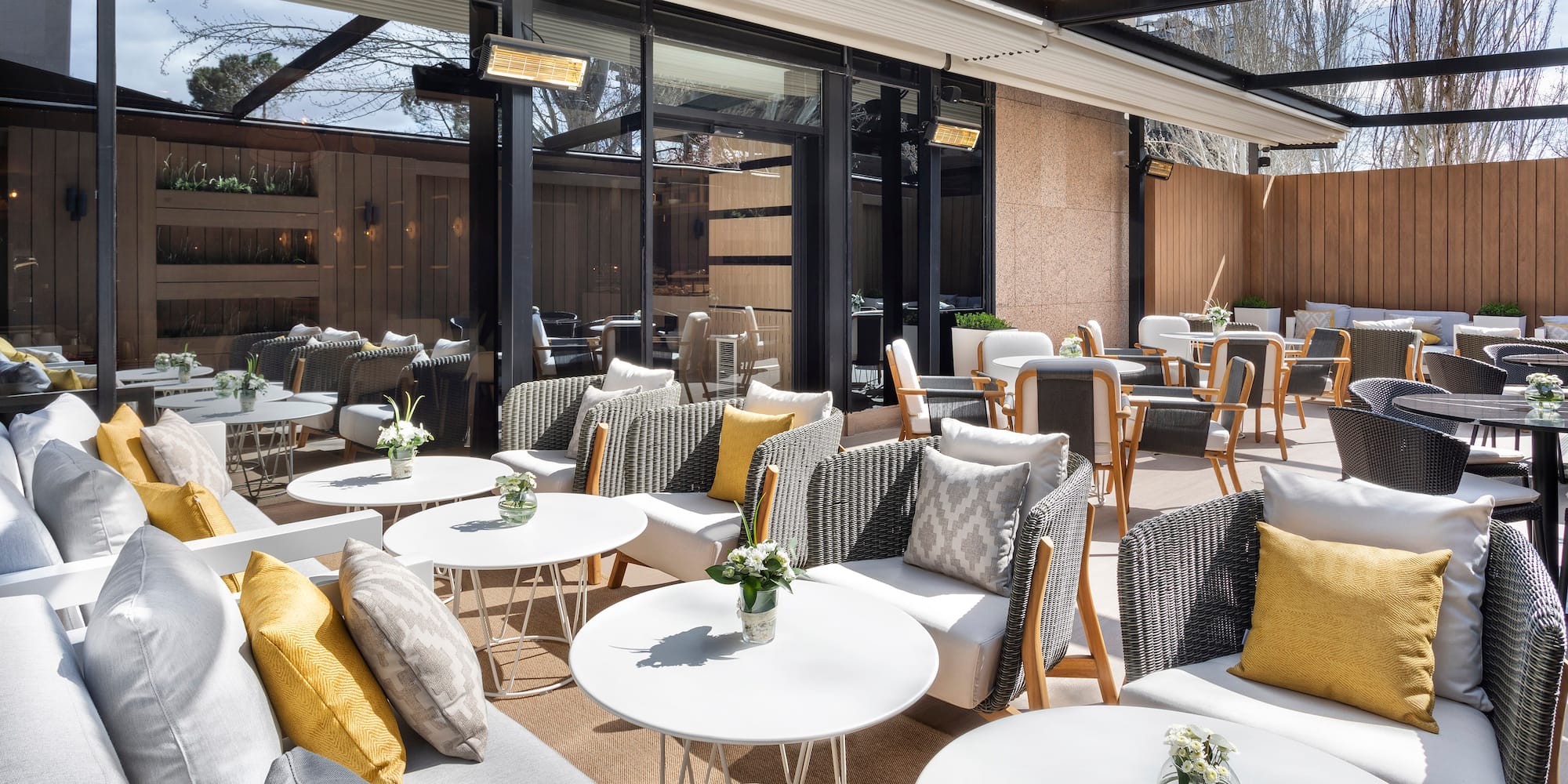 a patio with tables and chairs