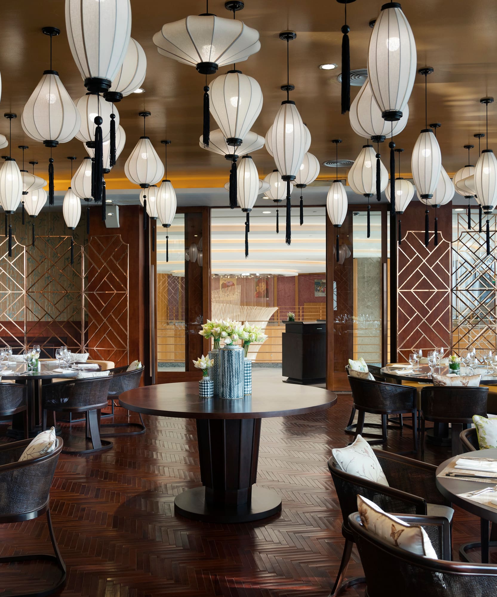 a restaurant with round tables and chairs