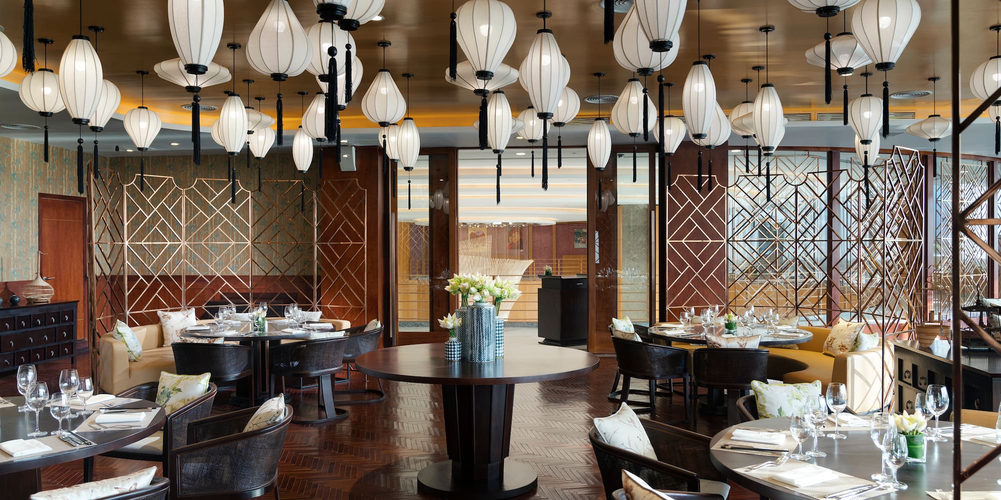 a restaurant with round tables and chairs