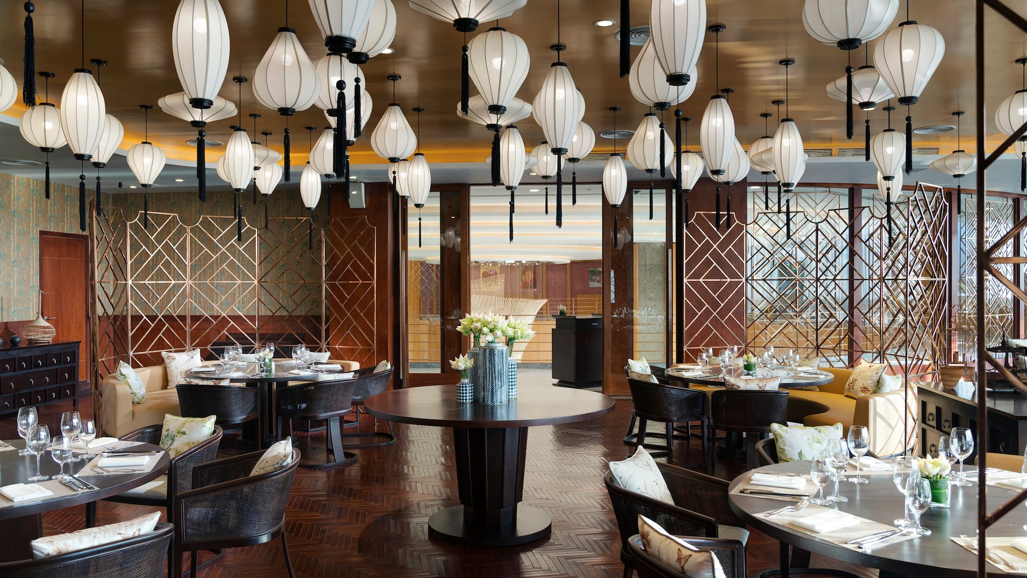 a restaurant with round tables and chairs