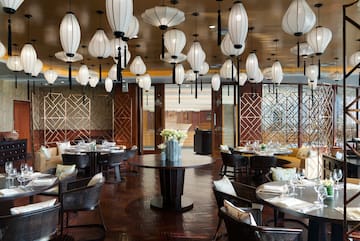 a restaurant with round tables and chairs