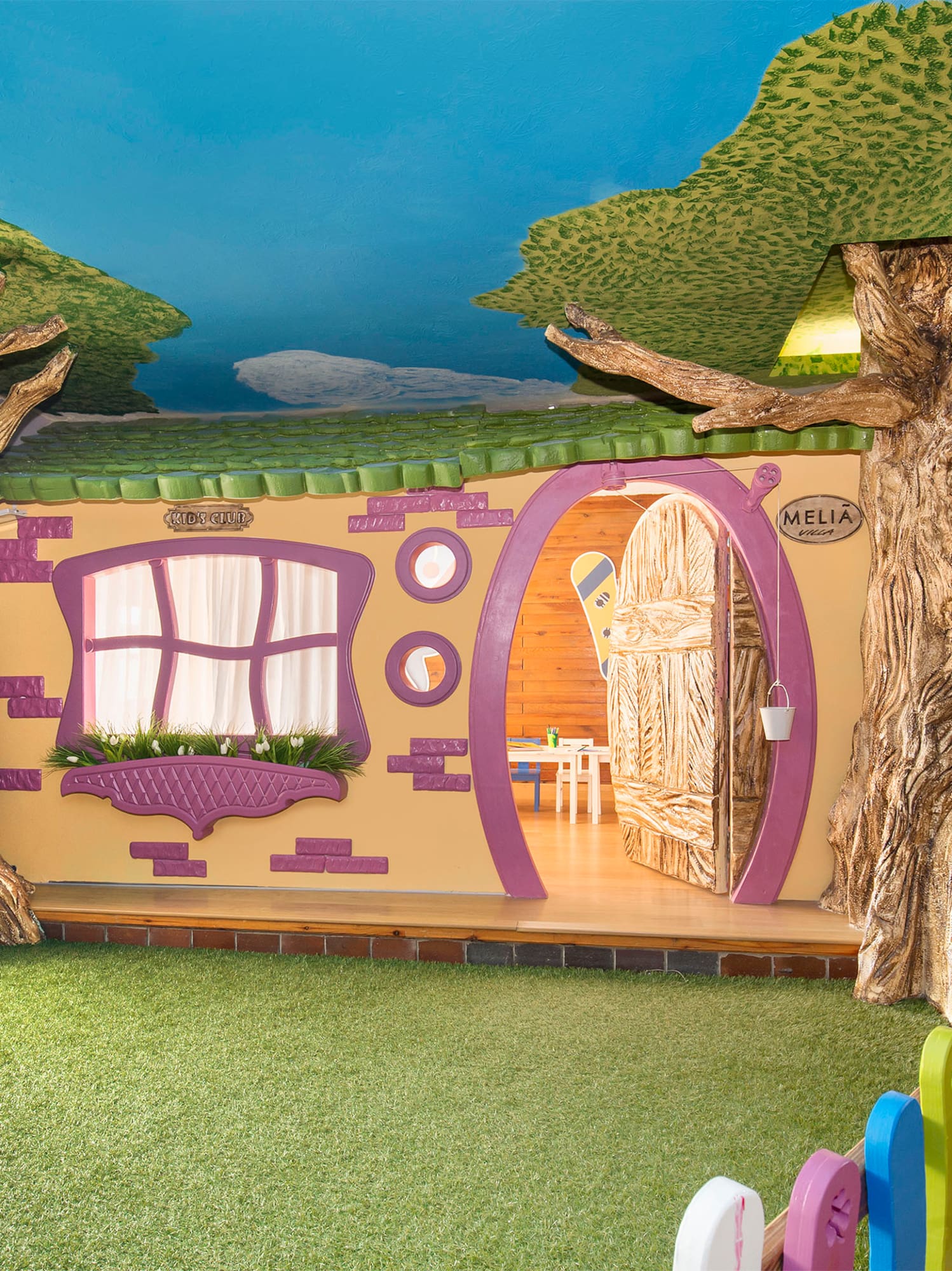 a room with trees and a fence