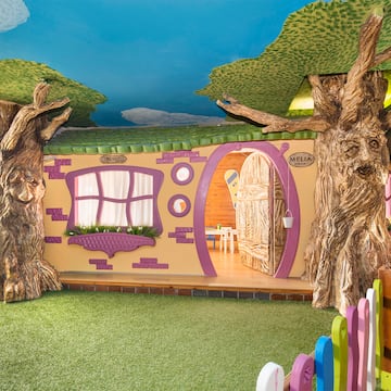 a room with trees and a fence