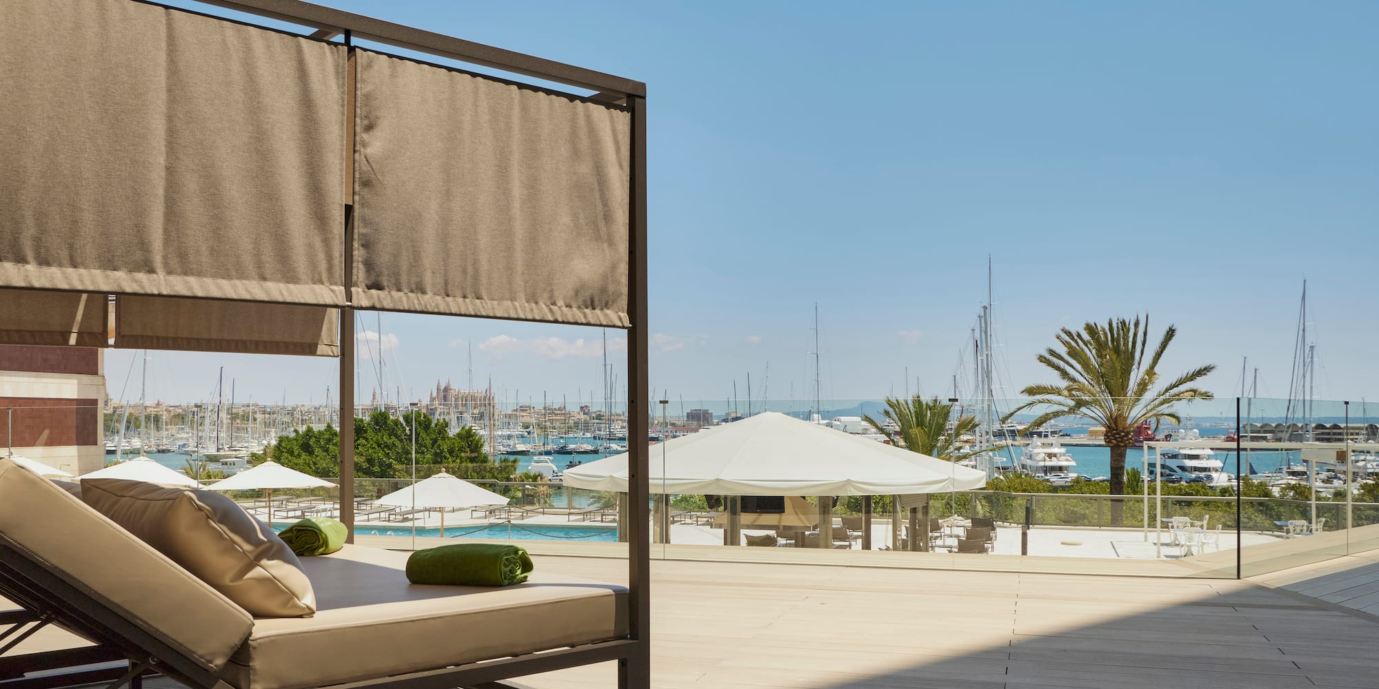 a patio with a couch and a view of the water