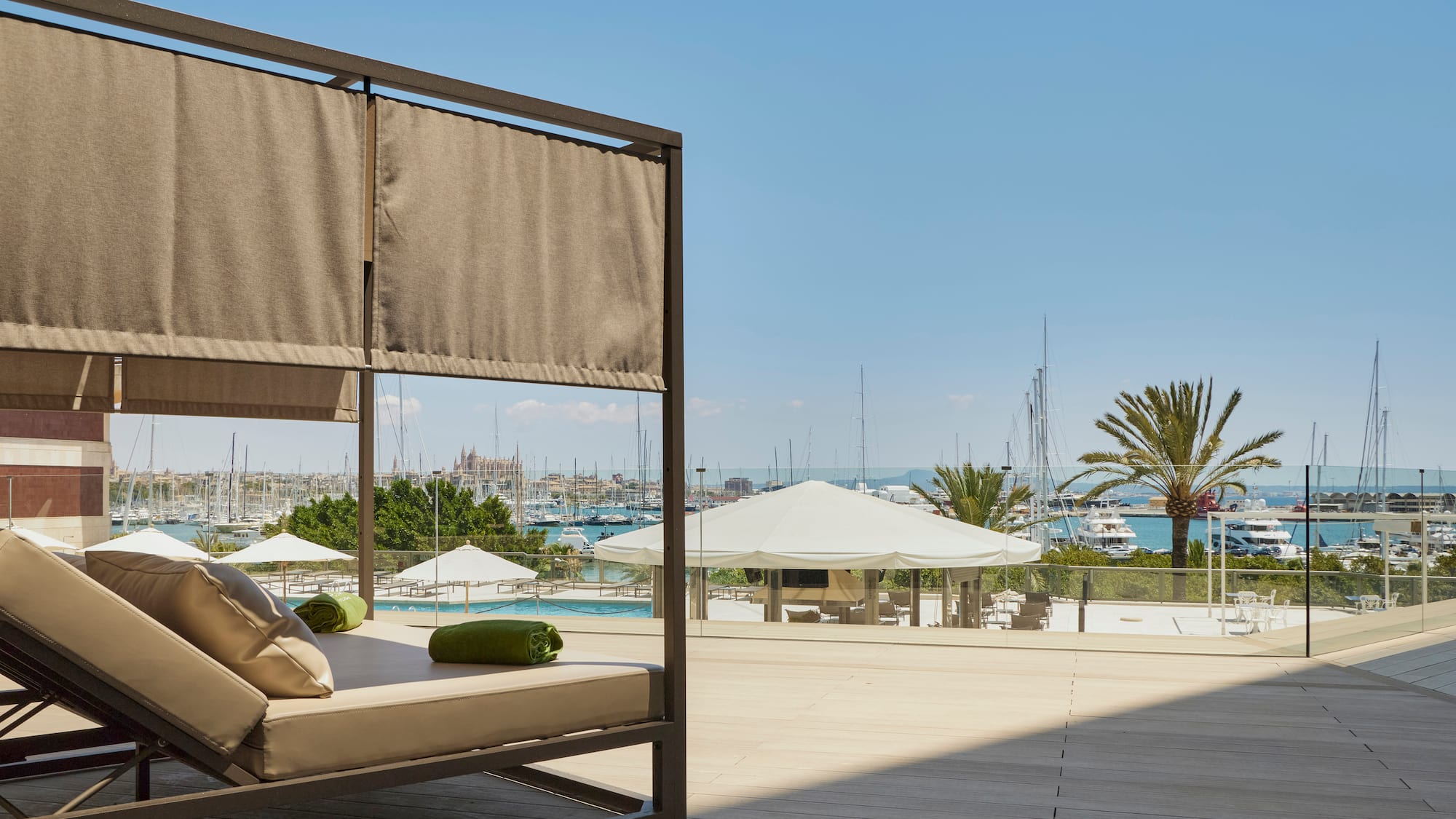 a patio with a couch and a view of the water