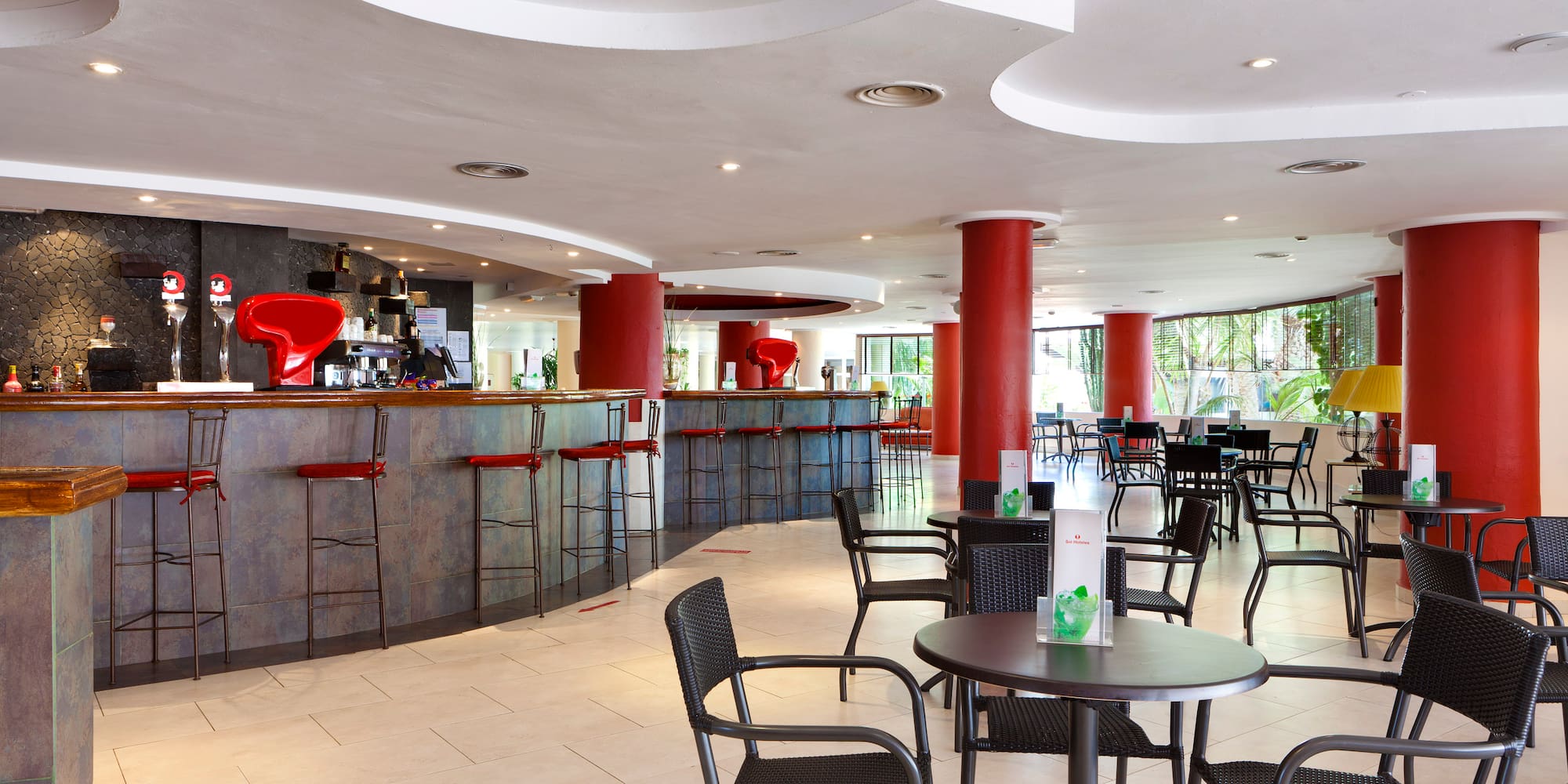 a room with tables and chairs