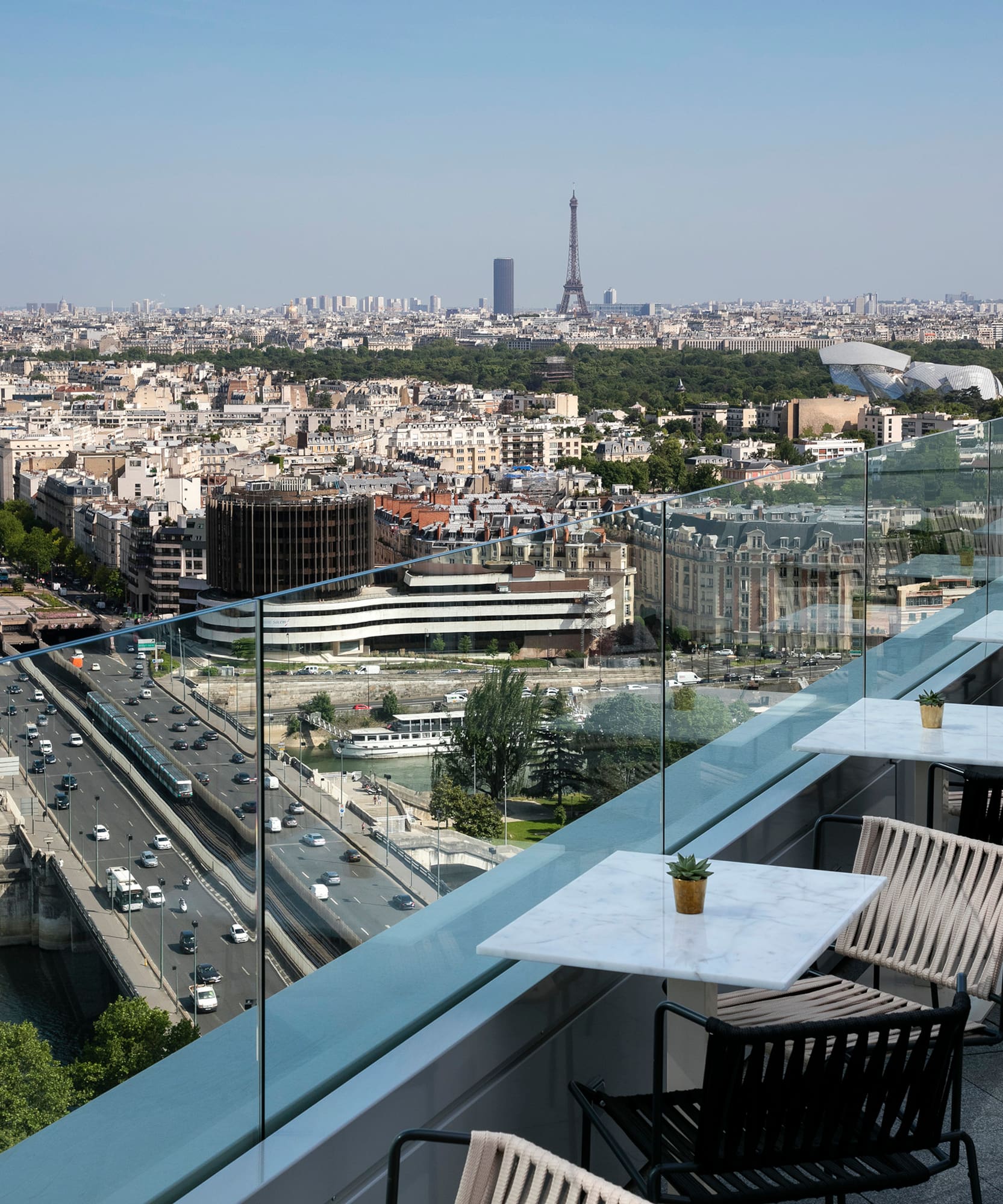 a view of a city from a rooftop bar