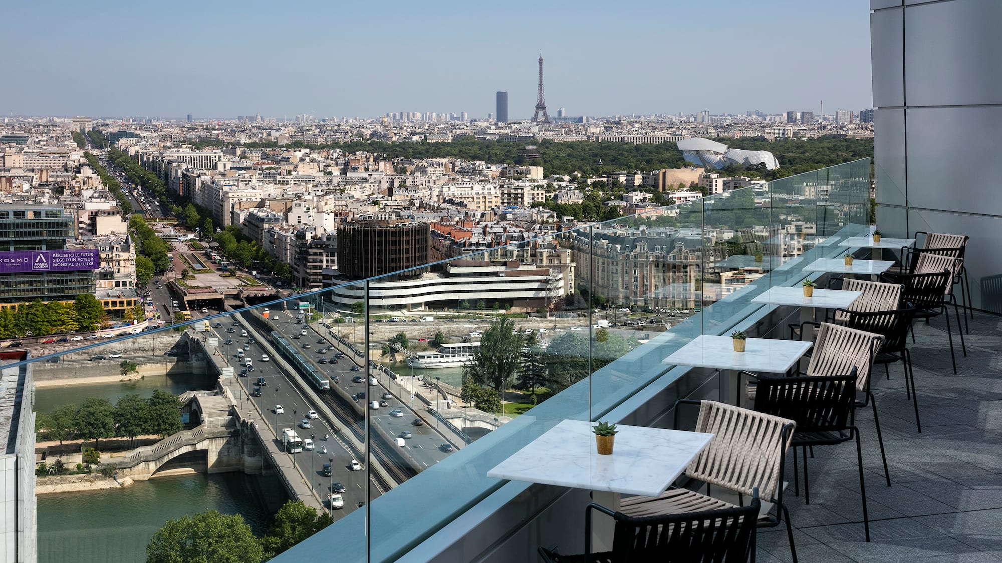 a view of a city from a rooftop bar