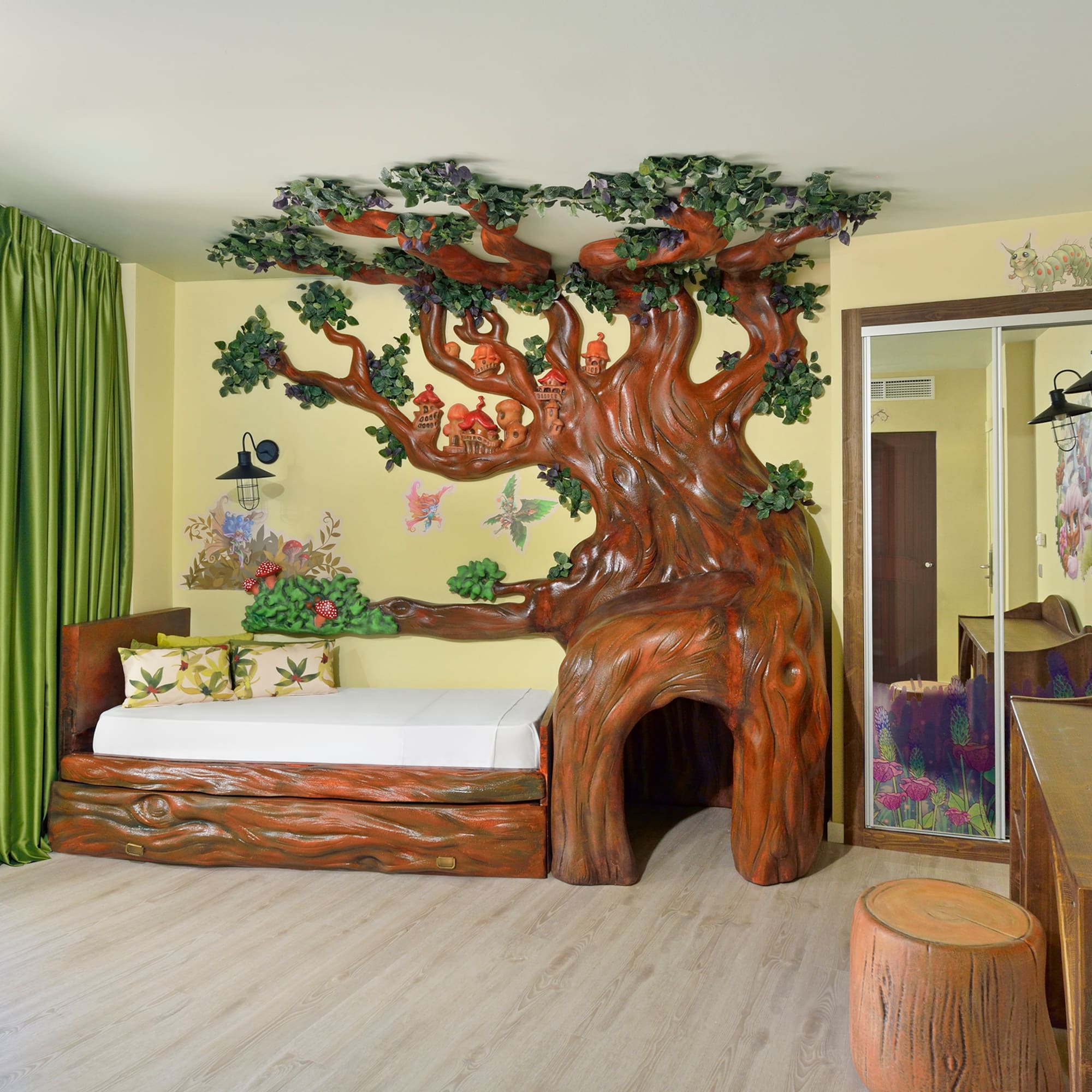 a room with a tree shaped bed