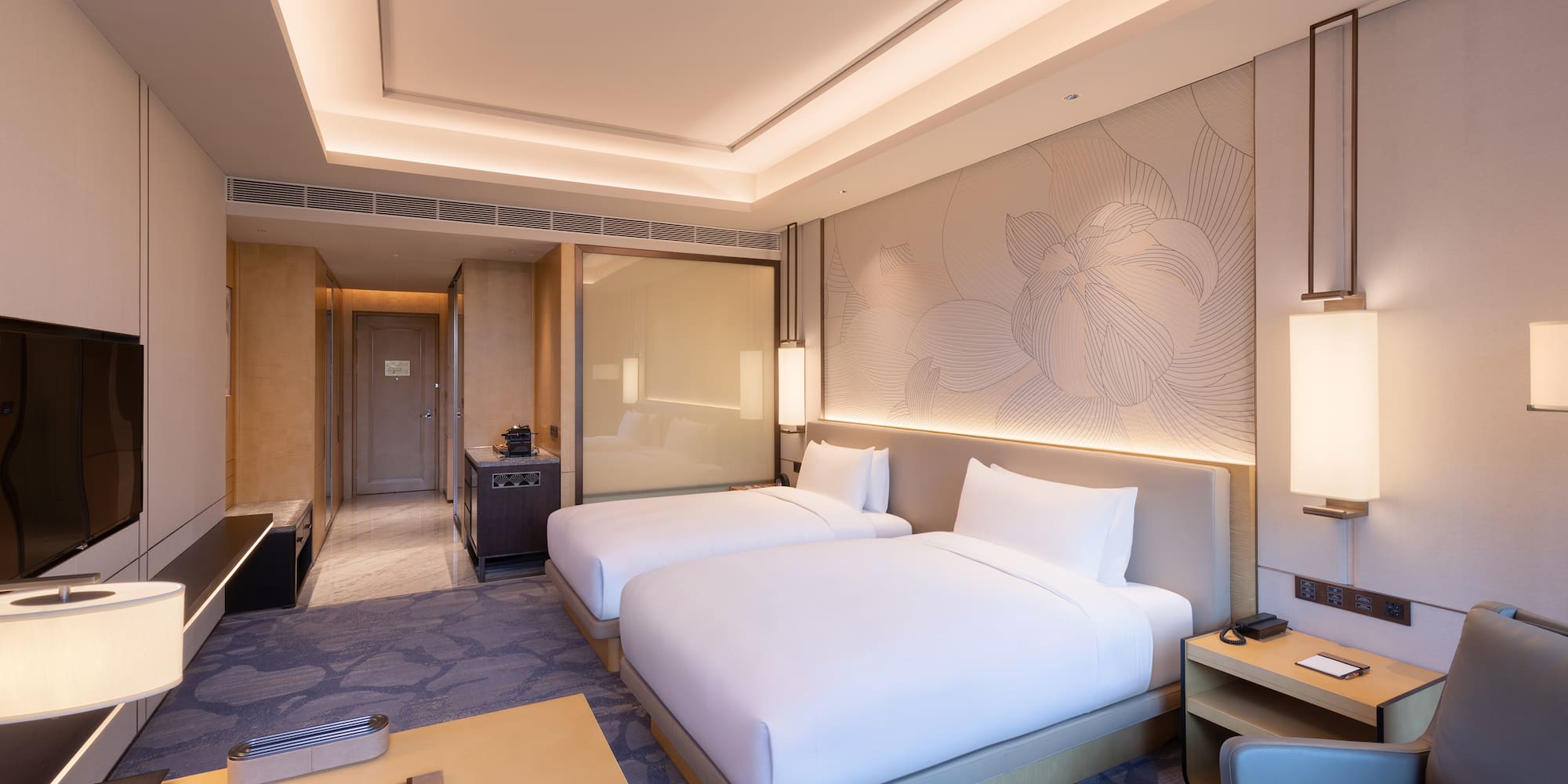 a hotel room with two beds